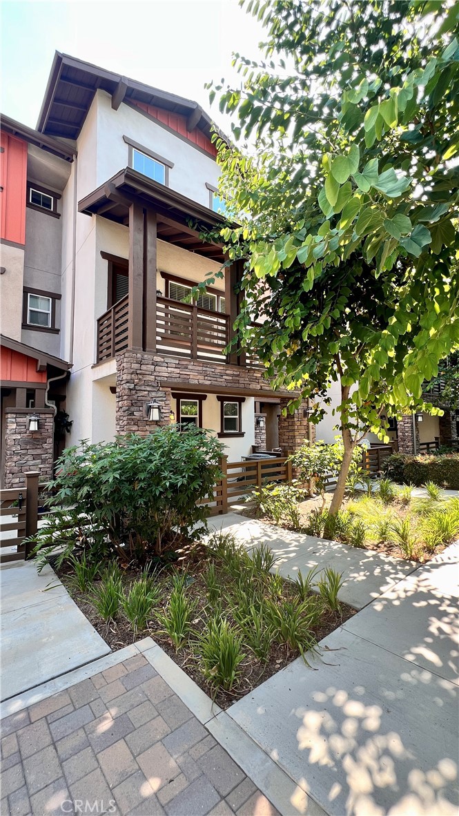 Welcome to this beautifully maintained 3-bedroom, 3-bathroom condo, perfectly situated in the peaceful interior of the community, away from traffic noise. Two bedrooms feature their own private en-suite bathrooms for maximum comfort and privacy. A charming path through lush greenery leads to the entrance, where you’ll find a fenced front porch beneath a second-level balcony. Inside, enjoy premium upgrades including top-brand built-in kitchen appliances, a very new refrigerator, a whole-home water filtration system, upper-level laundry, fire sprinklers, dual-pane windows, and a tandem two-car garage. Each bedroom is outfitted with a ceiling fan for year-round comfort and energy efficiency. The open interior boasts clean lines and a neutral palette, creating a modern and inviting atmosphere. Located in a top award-winning school district and within walking distance to multiple schools, this home is ideal for families seeking exceptional education opportunities. Commuters will appreciate the easy access to nearby freeways, while the close proximity to restaurants, major retailers, entertainment, parks, and medical facilities ensures everyday convenience.