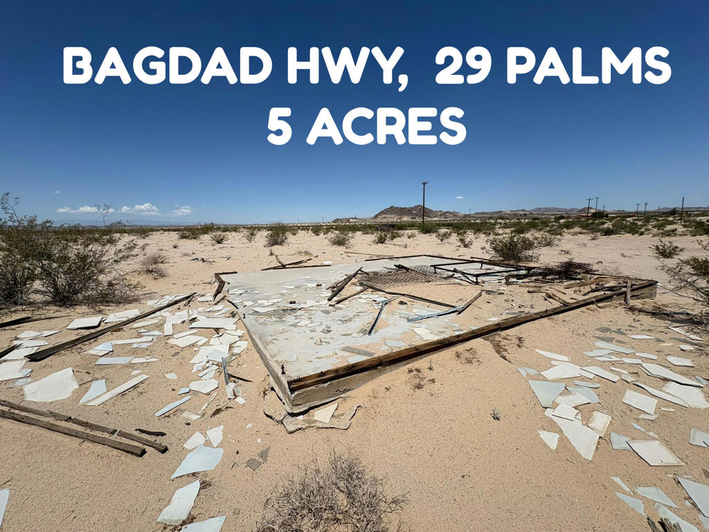 BAGDAD HIGHWAY, 29 PALMS $29,000.00: This 5 acres features a well-maintained dirt road located about a mile north of a paved road, ensuring easy accessibility. Water and power utilities are available along the street in front of the land.. It includes cement pad. Land offers beautiful views of the surrounding hills. The property is situated near the 29 Palms Marine base. A chain link fence along its southern boundary. A fire hydrant is conveniently located nearby. Might have old survey markers on land. The neighborhood boasts a variety of pleasant homes, creating a nice residential environment. Owner will carry loan of $23,200.00 with 20% down $5,800.00 @ 7% interest amortized over 5 years payable $459.39 per month + $15.00 month loan service fee. APN 0622-251-35-0000.DIRECTIONS: From Adobe Road take a right on Amboy Road to left on Bagdad Highway go up a few miles on the paved road then dirt road about a mile. Land is on right side look for FOR SALE sign. Also land is one lot north of 3073 Bagdad Hwy.(google address)