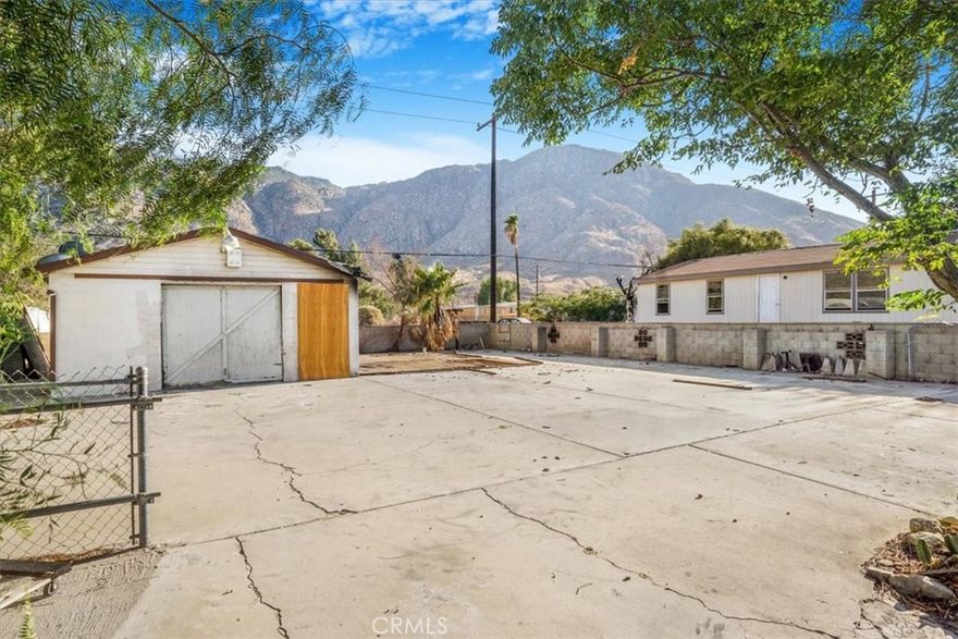 Discover the potential at 51977 Adele Avenue in Cabazon! This 5,227± sq. ft. lot offers a rare chance to rebuild, restore, or create your own desert retreat. A mobile home once occupied the property but was lost to fire—what remains is a 25' x 20' garage, a concrete pad, and existing utilities, though the buyer should verify condition and any needed updates. The lot is fully fenced with a mix of block wall and chain link, providing both privacy and security. From the property, enjoy sweeping mountain views and the natural desert backdrop that makes this location so special. Cabazon is a growing desert community that combines small-town charm with convenience. Just minutes away are the world-famous Cabazon Dinosaurs, the Cabazon Outlet Mall for premier shopping, and Morongo Casino Resort & Spa for dining and entertainment. The local elementary school, library and community center are close by, Interstate 10 provides easy commuting, and Walmart and Home Depot are only 10 miles away. Palm Springs and desert resorts are just a short drive for even more recreation and lifestyle options. Please note: any red lines shown in photos are for parcel identification only and do not represent exact property boundaries. Buyer to verify all information with the appropriate agencies. Don’t miss this opportunity to secure a buildable lot with existing improvements in one of Southern California’s most accessible desert locations!