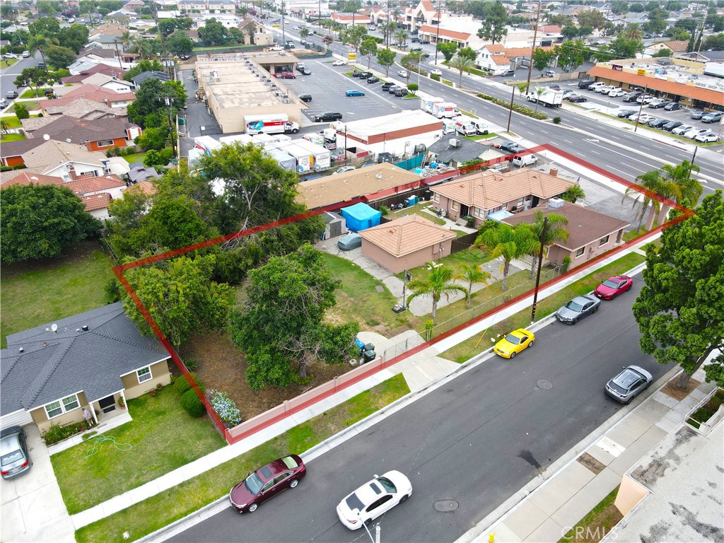 Investment opportunity in Downey! This mixed-use property has two offices and a two bedroom house on a 17,000+ sq ft lot. The two offices are currently being rented by one tenant and the large 2 bedroom 1 bath SFR is receiving excellent market rent, but can be delivered vacant. This corner lot has 8 parking spots plus a long driveway leading to the back on the Telegraph side, and a driveway on the Hasty side with access to more parking, including RV parking, and the large yard. There are multiple possibilities going forward: keep the current tenants, utilize the offices for your own use, live in one and work at the other, add additional structure(s) with the extra land, or tear it all down and build a large office building.