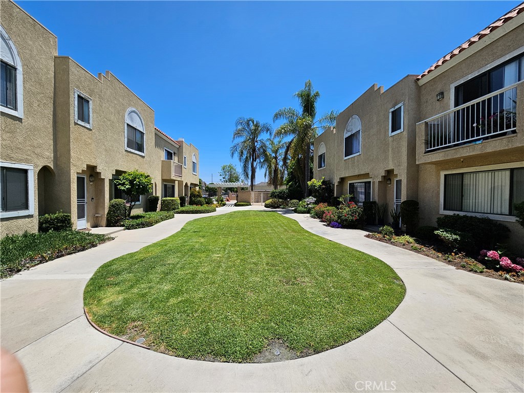 MOVE-IN READY TOWNHOME IN WEST GARDEN GROVE: Beautifully upgraded 3 BD/2 BA home features open floor plan, remodeled kitchen with granite counters and newer cabinets, breakfast bar, crown molding, ceiling fan, spacious living room with fireplace, laminate and tile flooring, upgraded patio sliding door, individual laundry room, and private patio. Upstairs features master bedroom with full ensuite bath, large walk-in closet and balcony, plus 2 additional bedrooms with a full hallway bath. Great unit location with no one above or below. Rarely listed home in a quiet gated community near shopping centers with easy freeway access. This turnkey townhome offers comfort, convenience, and lifestyle in one of Garden Grove’s most desirable neighborhoods. Sellers dropped $20,000.00 for a quick sale. Don’t miss your opportunity to call it home!
