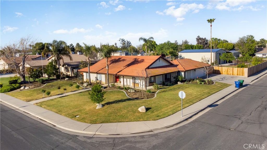Check this one out, located in Northwest Bakersfield! Situated on a spacious half-acre corner lot, this meticulously maintained property offers everything from an open floorplan, to the stunning outdoor oasis, a large shop and every detail has been thoughtfully designed to enhance your lifestyle. For starters there is wood-look tile flooring throughout the home. The living room features beamed ceilings and an awesome fireplace. Featuring three bedrooms plus an office, two bathrooms, this home won't disappoint. The kitchen is complete with ample space including a breakfast counter, lots of storage including a pantry. The backyard is like your own private retreat, with a covered patio overlooking the lush landscaping and sparkling beach entry pool. Lastly there is a large 2,000 sqft shop, ideal for your toys, hobby, storage, a home gym or whatever you desire. Don't miss your chance to make this one yours!