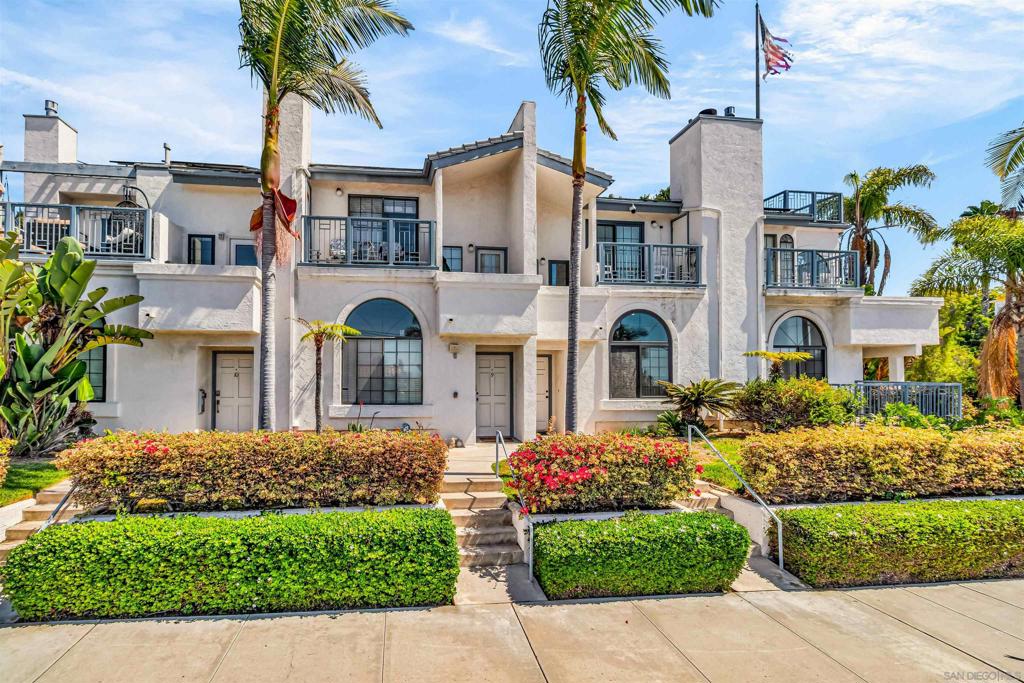 Stunningly updated Mission Hills townhome that offers a rare combination of modern upgrades, energy efficiency, and exceptional outdoor living. The home showcases dramatic vaulted ceilings, arched windows, and a flowing floor plan that connects the remodeled kitchen, dining area, and living room. The living room opens to a large, private terrace with sweeping views—an ideal setting for entertaining or relaxing. The primary suite is a true retreat with vaulted ceilings, a spa-inspired bathroom, and two private balconies that capture natural light and neighborhood charm. Upgrades include a remodeled kitchen with KitchenCraft cabinetry, Thermador appliances, and a gas stove, plus a luxurious primary bathroom with a freestanding tub, custom shower, and dual vanities. A deck conversion created a spacious walk-in closet, while another was reimagined as a private office with maple cabinetry. Energy efficiency is unmatched with fully owned solar installed in 2024—16 Panasonic panels with a 25-year warranty—keeping the average annual power bill around $600 while charging two electric cars and running A/C in the summer. The roof was replaced in 2021, and a rare two-car garage provides convenience and additional storage. The $525 monthly HOA covers water, trash, recycling, gardening, roof maintenance, high-speed internet, and exterior building upkeep. Perfectly located just minutes from downtown, the airport, Balboa Park, and Mission Hills’ charming shops and dining, this home blends sustainability, style, and an unbeatable location.