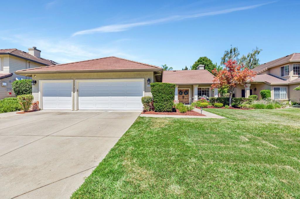 Stunning single level home has been remodeled throughout and shows like a dream! Featuring current / on trend colors throughout the home**kitchen with stainless appliances, large custom island, custom designed eat-in-nook, decorative & recessed lighting, pantry & soft close cabinets**warm & inviting wood burning fireplace with custom stack stone and mantle in family room, new window coverings, beautiful flooring throughout, separate living room and dining room, bathrooms with custom tile, stall showers and soaking tub in primary**Custom front doors, large windows with light, bright functional floor plan, mirrored closet doors, custom closet in primary by Closet World**Indoor laundry with extra storage, low maintenance landscaping with auto sprinklers front & back, 3 car attached garage! Neighborhood park with no HOA**You won't want to miss this one!!