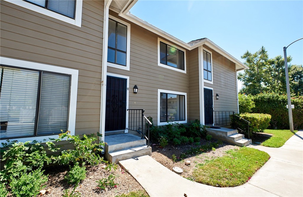 Remodeled two-story condo in Orange. Brand new kitchen cabinets, countertops, and backsplash. Luxury vinyl plank flooring throughout. Lighting and ceiling fans. Central air and heat. Half bathroom downstairs and full bath upstairs with laundry. One car garage. Private backyard. Community pool and spa. Appliances include stove, dishwasher, and microwave. Photos have been virtually staged for illustrative purposes only and does not include refrigerator. Easy access to 22 & 57 freeways and 1 mile to downtown Orange with shopping and great restaurants.