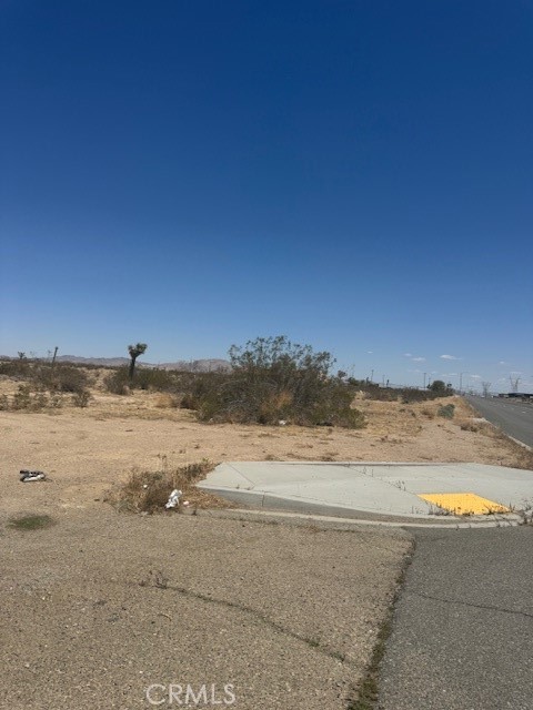 Prime 1.96-Acre Industrial Lot in Growing Adelanto!
This nearly 2-acre corner lot is zoned Manufacturing/Industrial (M/I), offering a wide range of development opportunities including warehousing, trucking, cannabis cultivation, and light industrial. Located just off paved Rancho Road with curb access and utilities nearby, it’s ideally situated less than half a mile from Highway 395 and only minutes from Interstate 15 and the Southern California Logistics Airport (SCLA). The lot is flat, buildable, and enjoys panoramic desert and mountain views, with easy access to key transit routes and a nearby post office. Adelanto is on the rise, fueled by the expansion of the SCLA, Amazon facilities, and the upcoming Brightline West bullet train project connecting Southern California to Las Vegas via nearby Barstow. This parcel lies within a designated Opportunity Zone, offering potential tax incentives for investors or developers. Whether you're looking to build now or hold as an appreciating asset, this strategic location offers long-term upside in one of the High Desert’s fastest-growing industrial corridors. Take advantage of this amazing opportunity to own this promising land and piece of the future growth of Adelanto!