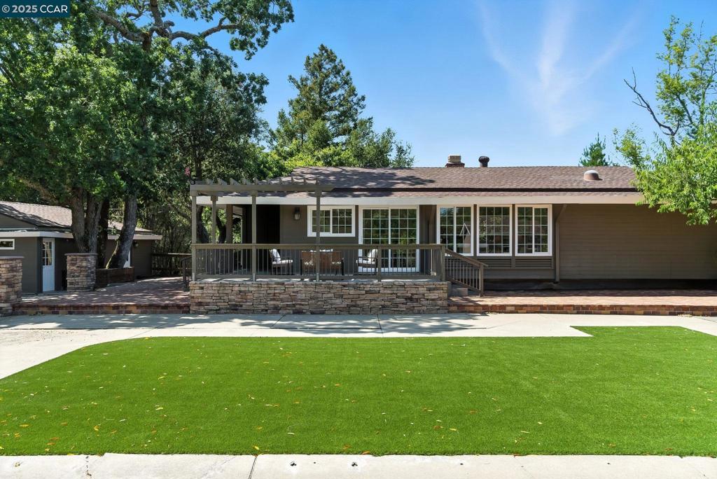 A RARE ORINDA GEM. Tucked away in a magical, gated setting, this stunningly remodeled single-level home offers an exceptional blend of style, space, and versatility. Set on an expansive private lot, the main residence features 2 generous bedrooms, 2 full bathrooms, an office/den, and an airy, open-concept floor plan with a designer kitchen, cozy breakfast nook, and sunlit living and dining area. Step outside to discover multiple decks, a built-in firepit, and a sprawling flat yard—perfect for entertaining, relaxing, or even adding a pool. What truly sets this property apart is its compound-style flexibility: a newly permitted 595 sq ft ADU offers ideal accommodations for guests, rental income, or multigenerational living, while a separate 256 sq ft bonus structure provides the perfect space for a gym, studio, or office. Located just minutes from downtown Orinda, BART, shopping, and award-winning schools, this one-of-a-kind retreat combines serenity and convenience in one of Orinda’s most coveted neighborhoods.