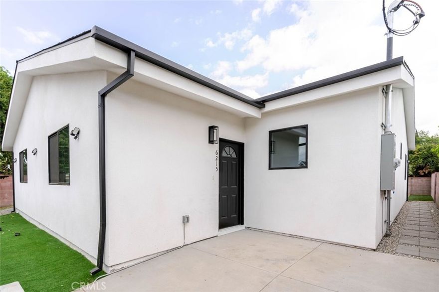 Modern Comfort in the Heart of Tarzana



Welcome to 6215 Sylvia Avenue, a beautifully remodeled single-family home situated on a lot with three separate residences for rent. This 1,100 sq. ft. home offers a seamless blend of modern finishes and timeless comfort.



Enter into an open-concept floor plan filled with natural light and recessed lighting throughout. The kitchen is the heart of the home, featuring an expansive island with white quartz countertops, custom built-in cabinetry, and stainless steel appliances, perfect for cooking and entertaining.



Enjoy the warmth of wood-toned vinyl flooring that complements the home's fresh white palette, creating a clean and inviting atmosphere. The primary suite features dual sinks, a spa-inspired tiled shower, and mirrored closet doors, offering both style and functionality.



Every detail of this remodel was designed for modern living, from the sleek finishes to the thoughtful layout that maximizes space and comfort.