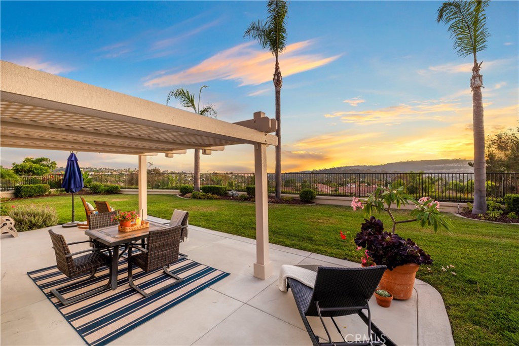 First time on the market! Welcome to 2 Novilla, a rare opportunity to own a coveted TROPHY OCEAN VIEW LOT| REPIPE | UPGRADED in the coastal community of Marina Hills! This meticulously maintained and updated home offers breathtaking expansive ocean and sunset views straight down the Salt Creek corridor from its premier cul-de-sac location! Step inside to soaring ceilings, gorgeous French oak wide planked hardwood flooring, cozy ledger stone fireplace and a stunning custom staircase featuring modern rod iron and oak railings. The light-filled kitchen boasts high ceilings, abundant storage, a sleek stainless-steel sink, plus newer stainless steel KitchenAid appliances—perfect for everyday living and entertaining. The home has been thoughtfully upgraded with newer replacement dual-pane windows, PEX repipe, fresh exterior paint, newer AC/HVAC, epoxy-finished garage, and more! Upstairs, the spacious primary suite showcases vaulted ceilings, a large walk-in closet, and a resort-inspired remodeled bathroom featuring travertine finishes, heated floors, dual sinks, heated towel rack, and a luxurious soaking tub. The secondary bedrooms are generous in size with vaulted ceilings, complemented by a beautifully remodeled secondary stone tiled bathroom with tiled wainscot. Outside, enjoy a RARE private wraparound yard with a charming pergola-covered patio where you can unwind and capture endless coastal sunsets and ocean views. Located in the highly desirable Marina Hills community, residents enjoy resort-style amenities including clubhouse, Jr Olympic pool, spa, tennis and pickleball courts, bocce ball, kid parks, and Salt Creek Trail, walking/biking trails close by - all just minutes from world-class beaches, Dana Point Harbor, and fine dining. 2 Novilla offers the perfect blend of coastal luxury, modern upgrades, and an unbeatable view—truly a rare find in Laguna Niguel.