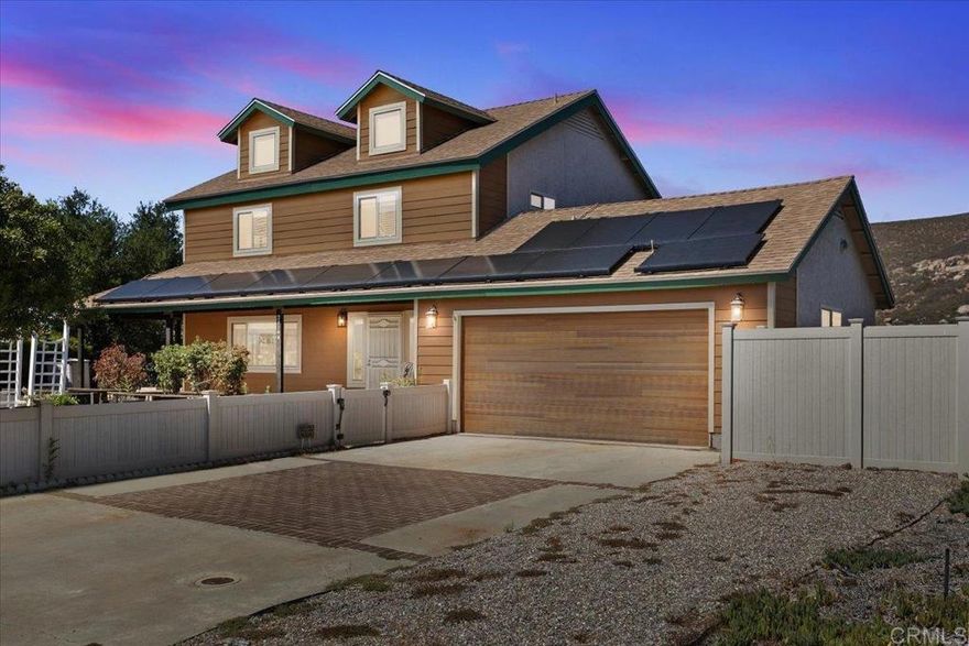 Welcome to your dream retreat! This stunning 3-bedroom, 2.5-bathroom home sits on .69 acres of beautifully landscaped land at the end of a quiet cul-de-sac, offering the perfect blend of privacy, comfort, and modern living. Step inside to an open-concept layout with a seamless flow between the living area, kitchen, and back patio—ideal for entertaining or everyday relaxation. The chef’s kitchen features a large entertainer’s island, walk-in pantry, and tons of cabinet space, all complemented by breathtaking mountain views that make cooking a joy. From the kitchen and dining area, enjoy easy access to the spacious patio overlooking a sparkling pool, lush backyard, and panoramic scenery. Solar system is leased for energy efficiency and cost savings. This home truly captures the best of indoor-outdoor living with unmatched views, a peaceful setting, and a prime cul-de-sac location.