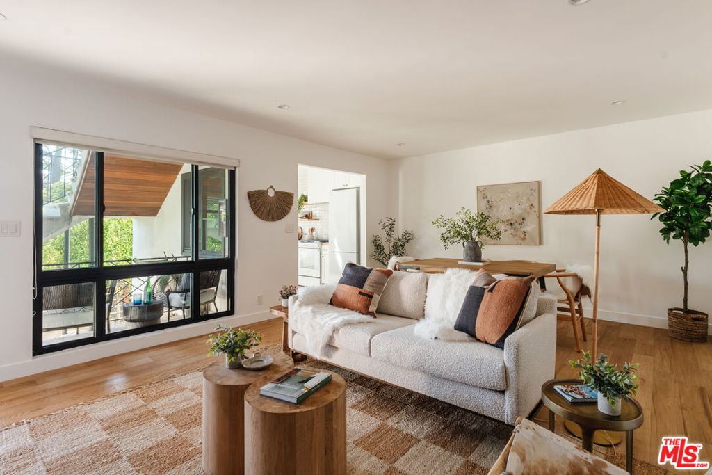 Bright, Spacious & Beautifully Remodeled in Prime Santa Monica. Set in the coveted Sunset Park neighborhood, just minutes from Santa Monica's world-famous beaches, trendy restaurants, and vibrant farmers markets, this stunningly remodeled oversized 1-bedroom is the perfect blend of modern comfort and coastal charm. This clean and airy ground-floor corner unit features French white oak floors throughout, abundant natural light, and plenty of room for a home office. The kitchen is a design lover's dream with an organic tile backsplash, new cabinetry, floating shelves, crisp white appliances, and warm butcher block countertops. Every detail feels thoughtfully curated, from the brand-new black dual-pane windows and recessed lighting to artisan light fixtures, brass finishes, and a gorgeous full bath with bronze-print wallpaper, walnut vanity, and brass accents. The spacious master bedroom offers excellent closets, while the in-unit laundry area still leaves room for extra storage. Outside, a shared lower patio features a redwood deck with lounge and dining spaces, tucked behind lush greenery for privacy. Enjoy Santa Monica living at its best fresh ocean breezes, an unbeatable location, and a home that's as stylish as it is comfortable. EV Car charging at covered carport parking spot. This property is also listed for sale.
