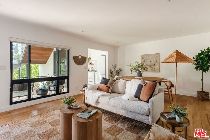Bright, Spacious & Beautifully Remodeled in Prime Santa Monica. Set in the coveted Sunset Park neighborhood, just minutes from Santa Monica's world-famous beaches, trendy restaurants, and vibrant farmers markets, this stunningly remodeled oversized 1-bedroom is the perfect blend of modern comfort and coastal charm. This clean and airy ground-floor corner unit features French white oak floors throughout, abundant natural light, and plenty of room for a home office. The kitchen is a design lover's dream with an organic tile backsplash, new cabinetry, floating shelves, crisp white appliances, and warm butcher block countertops. Every detail feels thoughtfully curated, from the brand-new black dual-pane windows and recessed lighting to artisan light fixtures, brass finishes, and a gorgeous full bath with bronze-print wallpaper, walnut vanity, and brass accents. The spacious master bedroom offers excellent closets, while the in-unit laundry area still leaves room for extra storage. Outside, a shared lower patio features a redwood deck with lounge and dining spaces, tucked behind lush greenery for privacy. Enjoy Santa Monica living at its best fresh ocean breezes, an unbeatable location, and a home that's as stylish as it is comfortable. EV Car charging at covered carport parking spot. This property is also listed for sale.