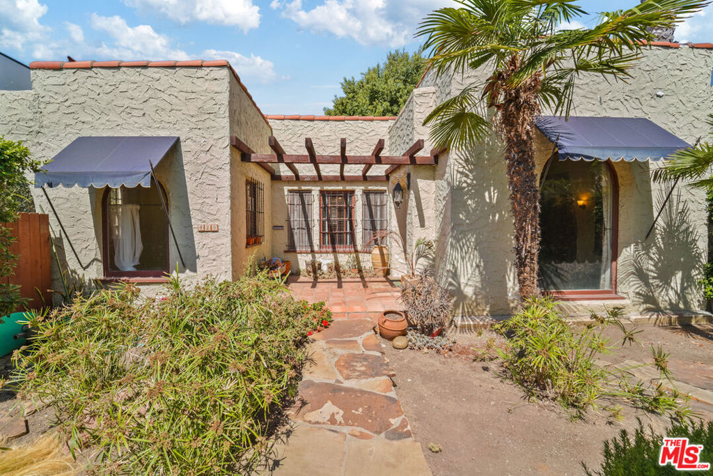 Discover the potential of this charming 1920's single-story Spanish home, brimming with timeless character and warmth. Perfectly situated near The Grove and the vibrant Melrose District, you'll enjoy close proximity to world-class designer boutiques, trendy restaurants, and cultural landmarks.Nestled on a picturesque, tree-lined street surrounded by multi-million-dollar residences, this property offers unmatched potential. The expansive 7,000 sq. ft. lot provides ample space for a pool, lush gardens and entertainment spaces. The oversized nearly 600-sqft garage presents an exciting opportunity for conversion into a guest house, studio, or full size ADU.Whether you're an end-user seeking to create your dream home, a developer looking to build new, or an investor eager to renovate, this prime location offers endless possibilities where prime location is key.