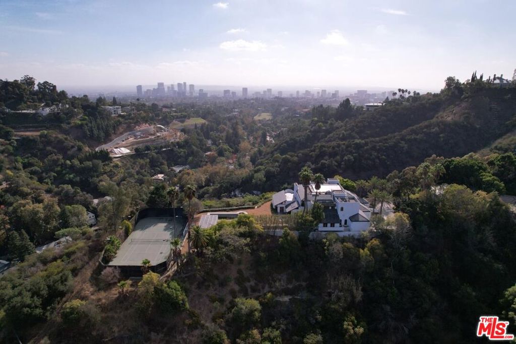 Welcome to 10690 Somma Way, a premiere Bel Air Estate located on a sprawling 4-acre parcel in a view promontory in one of the most coveted enclaves in Los Angeles. Somma Way offers 360-degree views of the city skyline and surrounding mountains near the iconic Hotel Bel Air and Bel Air Country Club. The residence spans approximately 9,753 square feet and features 5 bedrooms and 7 bathrooms. The property also includes a private tennis court and a pool area, offering great potential for outdoor enjoyment and recreation. Awaiting the personal touch of its next Owner, Somma Way is located on a cul-de-sac providing the peace of a personal oasis with close proximity to all that the City of Angels has to offer.