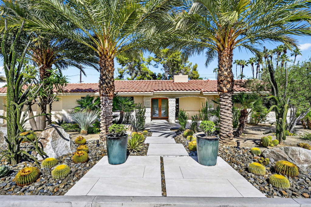 Welcome to a rare opportunity to own a fully renovated desert sanctuary in the heart of South Palm Desert with a detached casita.  Step beyond the professionally landscaped grounds and limestone-accented exterior into a stunning open-concept living space, highlighted by soaring vaulted hardwood ceilings and refined designer finishes. The family room centers around a cozy gas fireplace, while the gourmet kitchen impresses with a dramatic stone waterfall island with seating for six, a six-burner range, wine and beverage fridge, and generous cabinetry--designed for both function and flair.Expansive dual sliders create a seamless transition to the backyard oasis, where sleek porcelain flooring continues to the patio. Enjoy a resort-inspired setting with a pebble tech pool and spa, built-in barbecue, and custom fire feature--ideal for unforgettable alfresco gatherings beneath the desert sky.The spacious primary suite is a serene private retreat, featuring a spa-like bath with a rain shower, dual vanities, private water closet, and dual walk-in closets. Two additional guest bedrooms and a full bath are thoughtfully placed for privacy, complemented by an office, powder room, laundry area, and abundant storage throughout.A fully finished detached casita enhances flexibility with its own full kitchen, generous living area, and private dual entries from the backyard and side yard--perfect for extended family, guests, or rental potential.  Purchased Solar.  Listing Agent is Owner