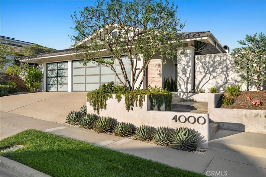 4000 Topside is a beautifully remodeled single-level home that exudes elegance and functionality in every detail. The spacious, chef-inspired kitchen features

commercial-grade refrigerators and a convenient pass-through to the outdoor entertaining area, creating a seamless flow for both daily living and special

gatherings. The home’s airy layout is enhanced by vaulted ceilings, filling the space with natural light. The primary suite has been expanded to create a true

sanctuary, complete with a spa-like bathroom and an oversized walk-in closet. An added highlight is the fourth bedroom, artfully reimagined as a walk-in wine

room, perfect for storing and displaying your collection. Two additional bedrooms offer comfort and privacy, while the interior laundry room and finished three-car

garage add convenience to this thoughtfully designed home. Perfectly blending coastal charm with modern amenities, 4000 Topside is more than a residence—it’s

a stunning Corona del Mar retreat for those who appreciate style, comfort, and an exceptional attention to detail.