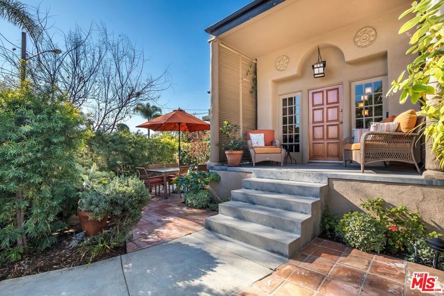 The duplex at 9000 Elevado sits on a corner lot in West Hollywood's prestigious Norma Triangle. This 1,470 sq.ft. townhome is a spacious, two-story 2BR/1BA unit with living, dining, kitchen, and laundry downstairs and 2 bedrooms upstairs. It has recently been updated with a spectacular kitchen with designer tile, granite counters, and high-end stainless-steel appliances. The unit has a laundry room (with sink), a gas fireplace, and new floors recently installed on both levels. There is one reserved uncovered parking space in the carport with an EV charger, and the private courtyard has mature hedges, lush plantings, and Saltillo tile work underfoot. There is plenty of privacy and room for outdoor living, dining, bbq-ing, and sunbathing. This Norma Triangle rarity is a short distance to grocery shopping, restaurants, bars, and shops. West Hollywood Park and its library (plus rooftop tennis) are close as well. Live the dream in WeHo!
