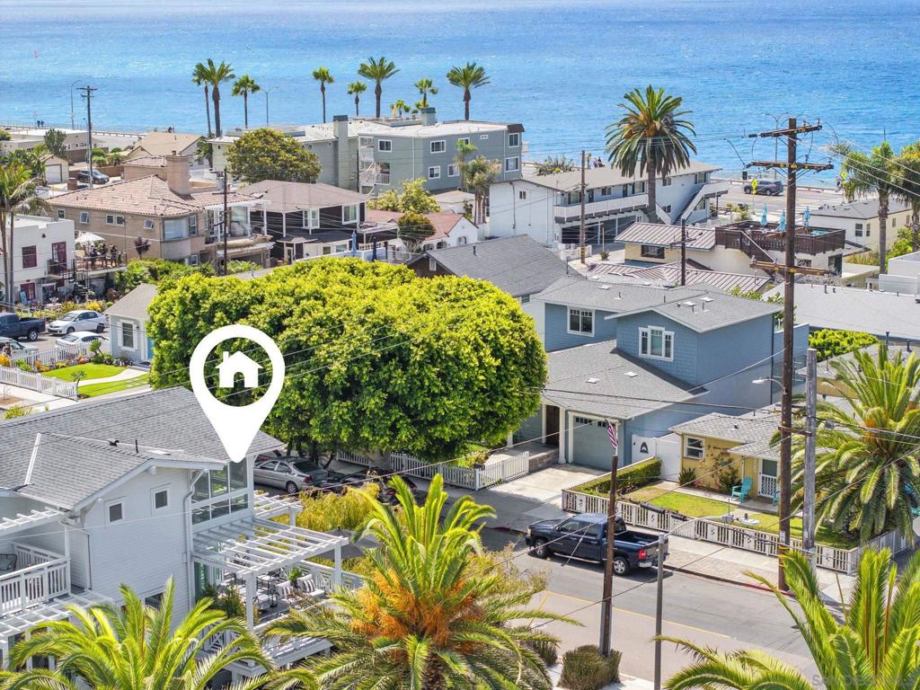 On the corner of Garfield & Walnut...Discover this exquisite, high-end luxury corner unit townhome, just 1 block from picturesque beaches of Carlsbad, offering stunning ocean views! This coastal gem has been meticulously remodeled to appeal to those w the most refined tastes. Lightly used & in pristine, turnkey condition, this corner unit boasts the largest footprint in the complex, featuring spacious outdoor area w wraparound patio & a 2nd-floor deck, perfect for embracing the quintessential Southern California lifestyle.The 1st floor opens to a lush patio & includes a versatile den/office & a 2ndary BD. You'll also find a full BA & laundry area on this level. Ascend to the 2nd floor to be captivated by the floor-to-ceiling windows & bifold doors that invite ocean breezes, leading to a wraparound deck w ocean views.Kitchen is a chef’s dream, featuring raised ceilings, spacious center island, specially designed reset cabinetry, Miele s/s appliances: gas stove, dishwasher & steam oven; and a side-by-side Sub-Zero refrig-all of which are still under warranty.Experience the open-concept living area w soaring ceilings, recessed lighting, ceiling fans, custom window coverings, & energy-efficient windows. The bi-fold doors seamlessly blend indoor & outdoor spaces, perfect for al fresco dining. The 2nd floor also hosts an elegant & secluded primary suite w a customized walk-in closet, dual vanities, a spacious shower & separate cast iron tub. An impressive upstairs loft bedroom w an ensuite BA & walk-in closet offer add'l ocean views.2-car garage+2-car driveway...(cont.supplement) On the corner of Garfield & Walnut...Discover this exquisite, high-end luxury corner unit townhome, just one block from the picturesque beaches of Carlsbad, offering stunning ocean views! This coastal gem has been meticulously remodeled to appeal to those with the most refined tastes. Lightly used and in pristine, turnkey condition, this corner unit boasts the largest footprint in the complex, featuring a spacious outdoor area with a wraparound patio and a second-floor deck, perfect for embracing the quintessential Southern California lifestyle. The first floor opens to a lush patio and includes a versatile den/office and a secondary bedroom. You'll also find a full bath and laundry area on this level. Ascend to the second floor to be captivated by the floor-to-ceiling windows and bifold doors that invite ocean breezes, leading to a wraparound deck with breathtaking ocean views. The kitchen is a chef’s dream, featuring raised ceilings, a spacious center island, specially designed reset cabinetry, Miele stainless steel appliances: gas stove, dishwasher and steam oven; and a side-by-side Sub-Zero refrigerator -all of which are still under warranty. Experience the open-concept living area with soaring ceilings, LED recessed lighting, ceiling fans, custom window coverings, and energy-efficient dual-glazed windows. The bi-fold doors seamlessly blend indoor and outdoor spaces, perfect for al fresco dining. The second floor also hosts an elegant and secluded primary suite with a customized walk-in closet, dual vanities, a spacious shower, and a separate cast iron tub. An impressive upstairs loft bedroom with an ensuite bath and walk-in closet offer additional ocean views. This home includes an attached 2-car garage with a driveway accommodating two additional vehicles—a significant advantage for beach living. Enjoy wood flooring throughout, custom stairways, a complete "Life Source" water purification system, along with a tankless water heater and newer central A/C. No detail has been overlooked on this property. Comprising three bedrooms plus a den/office that could serve as a fourth bedroom, this townhome is conveniently located near Carlsbad Village’s vibrant shops, Michelin-starred restaurants, farmers market, and train station, providing unparalleled privacy alongside luxury amenities. Everything in this property is custom & exquisitely done! You will be ...