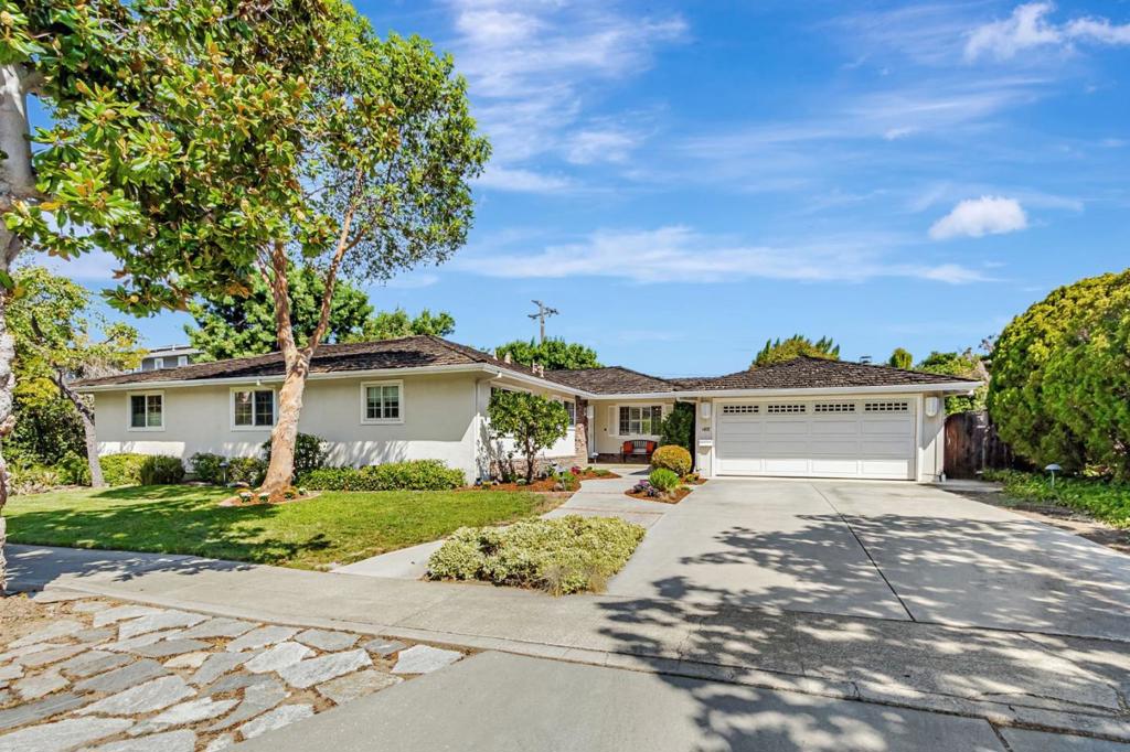 This charming single-story home is located in one of Sunnyvales most desirable neighborhoods, bordering Los Altos and Cupertino, with top-rated schools: West Valley Elementary, Cupertino Middle, and Homestead High. A brick-lined walkway leads to a cozy front porch, perfect for relaxing with a glass of wine and enjoying the sunset. The open-concept living space centers around the kitchen, dining, and family room. The family room features a floor-to-ceiling brick fireplace, bookshelves, and large windows that flood the space with natural light. Glass French doors offer a private retreat for study or relaxation. The oversized formal living room showcases a stunning stone fireplace and original hardwood floors. Sliding glass doors lead to a private backyard sanctuary with a pool, spa, and mature landscaping. Newer fencing surrounds the yard. With 2,177 sq. ft., 4 bedrooms, and 3 bathrooms, this home sits on a 9,630 sq. ft. lot. Conveniently located near Apple (3.3 miles), Stanford, Santa Clara University, and major highways, it offers easy access to shopping, dining, and outdoor activities. Ideal for Silicon Valley living!