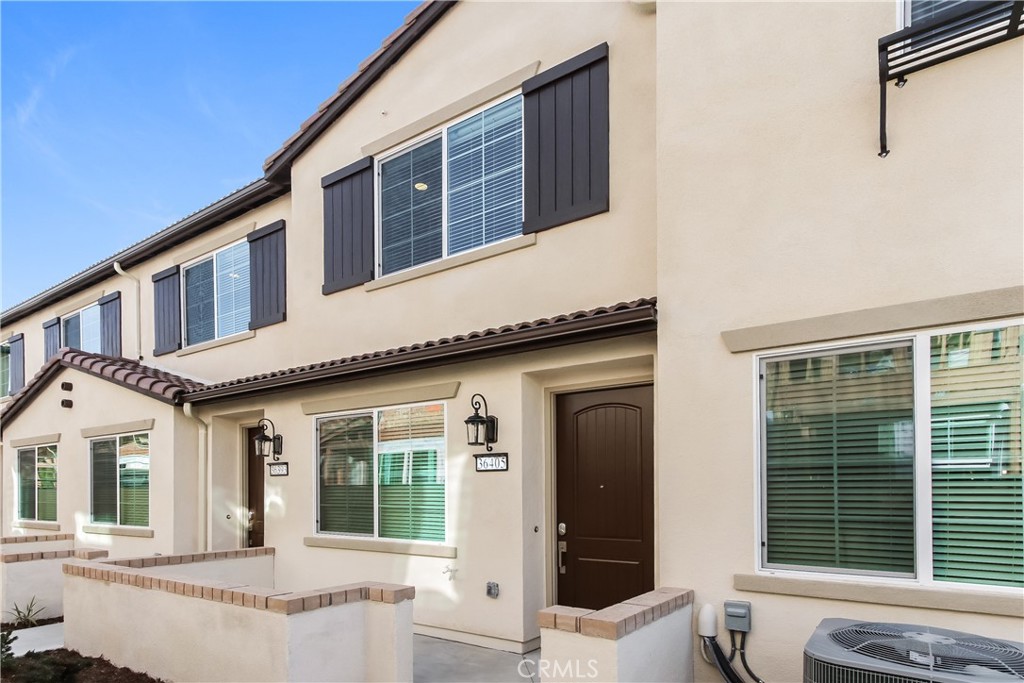 This home is professionally managed by Tricon Residential, dedicated to creating exceptional rental experiences. Featuring two bedrooms, two and one half bathrooms, and approximately 978 square feet, this townhome offers a high standard of rental living, supported by a team that puts residents first. Tricon Wildomar is a beautiful Spanish-inspired gated community centrally located just one hour from San Diego and Orange County. Enjoy virtually maintenance-free living with the conveniences of solar and smart home technology including automatic thermostat control and keyless front door entry all designed to provide an exceptional living experience. Every home includes an open-concept design, gourmet kitchens with quartz countertops and stainless steel appliances. Enjoy well-maintained amenities including a sparking pool with wifi, tot lot/playground, dog park, fitness center and clubhouse with rentable event space.