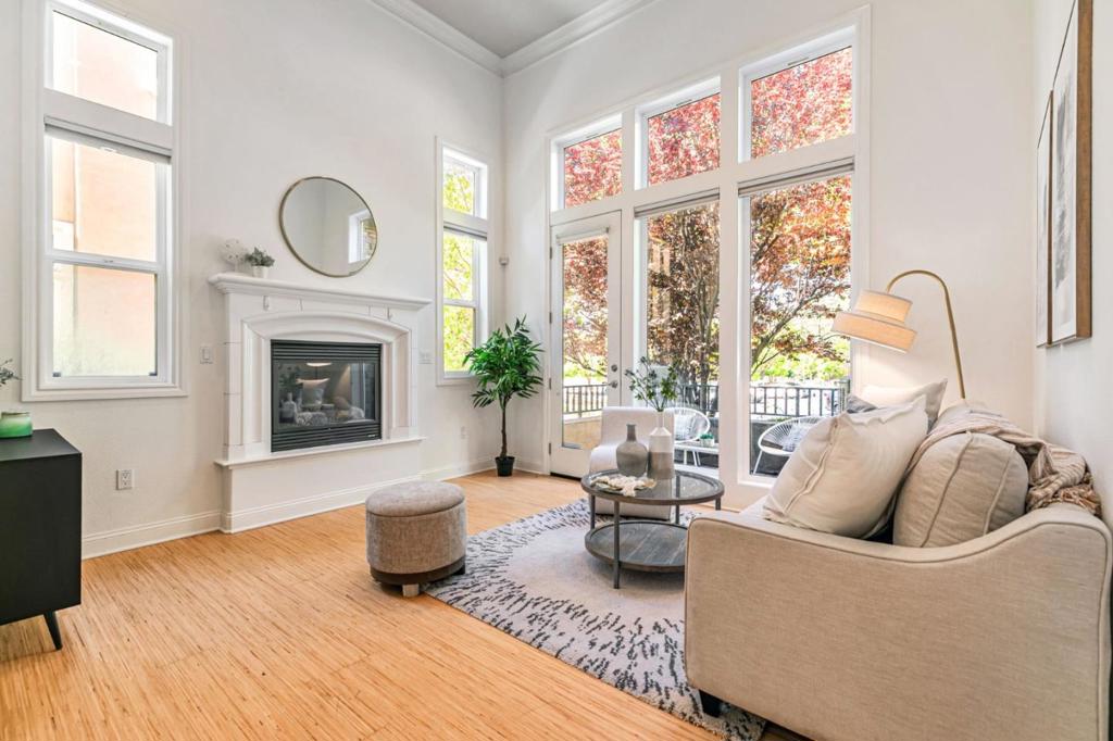 Dreaming of Luxury Living Close to Work? Stunning end-unit masterpiece by luxury builder Toll Brothers offers 4BD/3BA/2,036 SF upscale comfort in prime location, minutes to Cisco, Google, Apple, Amazon, BART & HWY 680/880/101. Community's best model lives like a 2-story single-family, featuring a coveted ground-floor bed+full bath, perfect for guests/multi-gen/office. Soaring 14-ft ceilings & 30+ dual-pane windows bathe the home in natural light, seamlessly blending indoor/outdoor living with front patio & 2nd deck ideal for BBQs/coffee. Chefs kitchen boasts Sub-Zero fridge, GE Monogram 6-burner dual-fuel range, Bosch dishwasher, granite counters, full backsplash, custom cabinetry & center island. Luxurious primary suite offers soaking tub, clear-glass shower, dual walk-in closets; Room-sized walk-in can serve as bedroom or be part of 2nd suite. New HVAC, hardwood floors, crown molding, wood shutters, fresh paint, cozy gas fireplace, fire sprinklers, built-in speakers, Innolux W/D, oversized 2-car side-by-side garage w/extra storage. Low HOA w/resort-style pool, spa, gym, clubhouse, ample guest/street parking. Walk to parks, golf, shopping & dining. Impeccable craftsmanship, thoughtful design and unbeatable location deliver the perfect blend of luxury and everyday convenience.