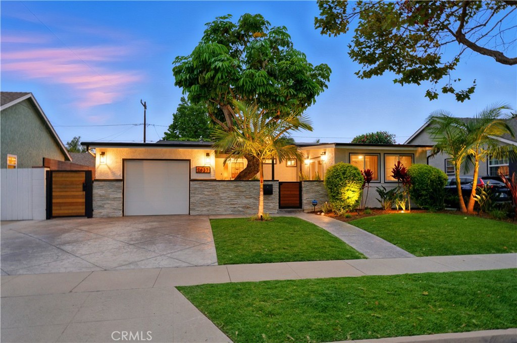 Welcome to 2637 Monogram Avenue—a beautifully updated three-bedroom, two-bathroom traditional home in the highly desirable El Dorado Park South neighborhood of Long Beach. This thoughtfully upgraded residence blends timeless charm with modern functionality. Inside, you’ll find a bright and open floor plan featuring newer dual-pane windows and fresh interior paint throughout. The spacious living room offers a warm and inviting atmosphere with a cozy fireplace, perfect for relaxing evenings or gathering with guests.
The remodeled kitchen showcases updated cabinetry, stainless steel appliances, and flows seamlessly into the main living areas. Just off the kitchen, a charming nook provides the ideal spot to enjoy your morning coffee while overlooking the backyard.
A versatile bonus room at the rear of the home offers flexible space ideal for a home office, exercise room, or yoga studio—with peaceful backyard views.
The main bathroom has been tastefully renovated with clean, contemporary finishes, creating a serene and stylish retreat. Additional upgrades include copper plumbing, an energy-efficient PPA solar system with EV charger, and newer windows for year-round comfort.
Step outside to a private backyard oasis featuring newer hardscape and low-maintenance landscaping. Enjoy a custom-built outdoor kitchen, dedicated dining space, lounge area, and a sleek louvered patio cover—perfect for entertaining or simply unwinding outdoors.
Ideally situated near El Dorado Park, with its expansive green spaces, tennis and basketball courts, skate park, soccer fields, and seasonal concerts, 2637 Monogram Avenue offers a vibrant lifestyle in one of Long Beach’s most sought-after communities. This turnkey home is ready to welcome you.