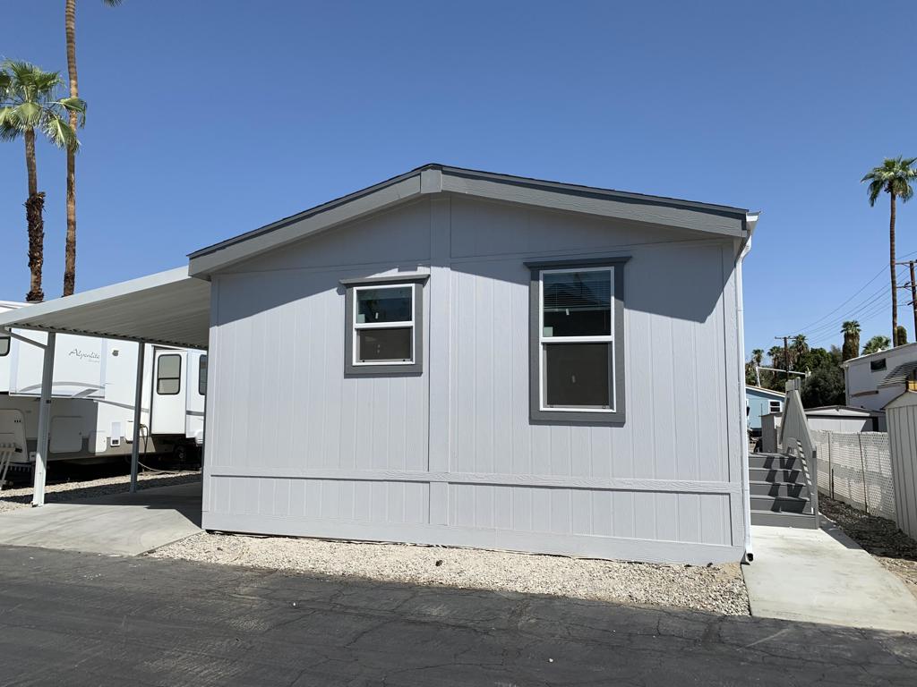 RENT SPECIAL: $100 off first 6 months. This brand new Fleetwood manufactured home has 1 bedroom, 1 bathroom and is approximately 620 sq ft. The kitchen has been upgraded with shaker style hardwood cabinets, granite countertops and backsplash, undermount stainless steel sink. The appliance package includes 18 CF refrigerator with icemaker, gas range, over-range microwave, dishwasher, and a garbage disposal. The bedroom and living room are carpeted; there is vinyl flooring throughout the remainder of the house. The bathroom has a glass enclosed tub/shower, granite countertop and backsplash, and undermount sink. Canned lighting, 3-door linen closet, area for stackable washer and dryer, covered carport parking and more!
