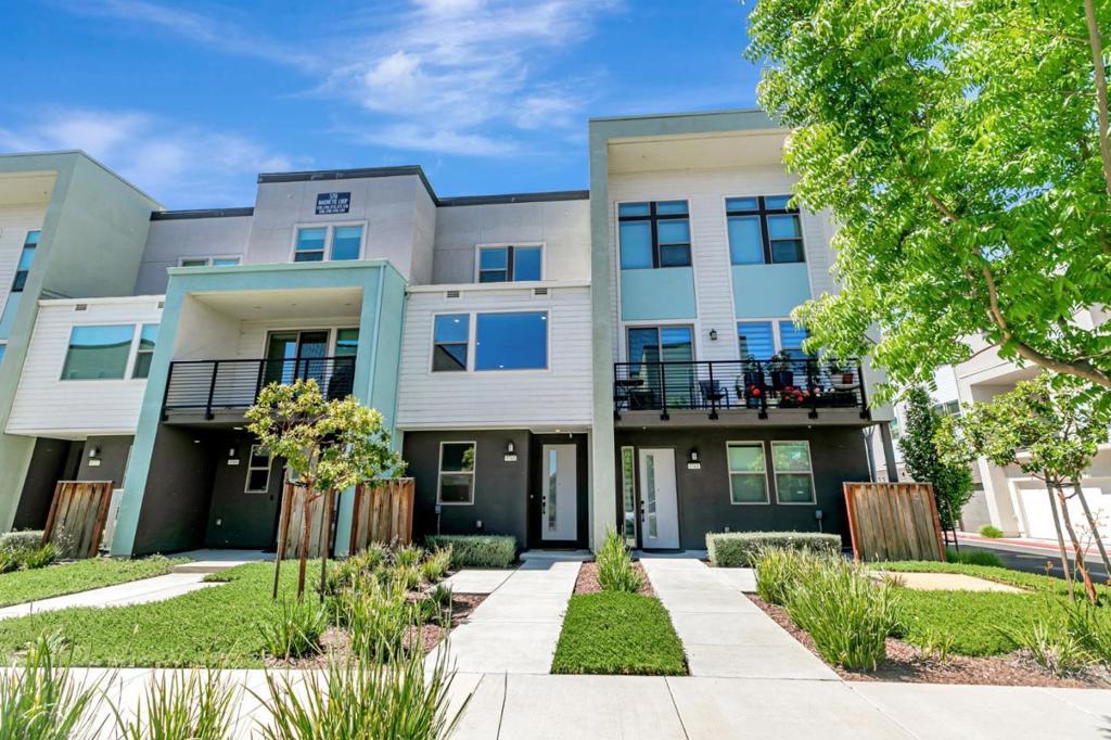 Beautifully upgraded 3 bed, 3.5 bath townhome in a quiet, well-maintained community. Built in 2019, this modern home features newer vinyl flooring throughout and a flexible layout with a ground-floor bedroom and full bath ideal for guests or a home office. The bright, open-concept main level boasts high ceilings, recessed lighting, and large dual-pane windows with serene hillside views. The stylish kitchen offers quartz countertops, a large island with sink, ample cabinetry, and high-end stainless steel appliances including a gas stove and range hood. Step onto the private balcony to unwind. The primary suite includes a walk-in closet and dual-sink vanity. Additional highlights: central A/C with zoned controls, tankless water heater, owned solar panels, 2023-installed water softener and RO system, and a spacious two-car side-by-side garage. The home is equipped with Cat 5E drops in key rooms and ceilings on all levels. Community features include parks, BBQ areas, gardens, multiple play structures, walking trails and more. Prime location near Highway 101/85, Caltrain, Costco, Shopping, and Santa Teresa Park. Ask us about the Quad boundary zone for the new school year which includes Santa Teresa Elementary as home school.