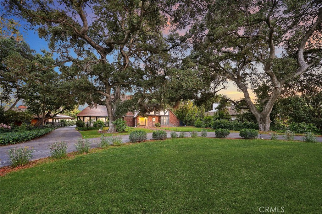 Prime Location in North Arcadia! Nestled in one of the most desirable neighborhoods, this property boasts a huge flat lot of 30,046 sqft, offering endless potential and outdoor amenities perfect for entertaining and relaxation.The estate features a standard tennis court, a sparkling swimming pool, and lush landscaping with mature fruit trees. The spacious residence is designed with charm and functionality, including a bright and airy living room, a formal dining room, and a family room with expansive windows overlooking the backyard.The primary suite includes French doors leading to a private covered patio, a large closet, and a luxurious en-suite bathroom. Two additional bedrooms, along with well-appointed bathrooms, complete the home’s thoughtful layout.Additional highlights include a detached 2-car garage with a U-shaped driveway, plenty of parking, and a versatile attic space perfect for a studio, office, or extra bedroom.Conveniently located close to the Santa Anita Racetrack, Los Angeles County Arboretum, the shops at Santa Anita, and top-rated schools.Don’t miss this rare opportunity to own this high-potential classic English-style home in the heart of North Arcadia!
