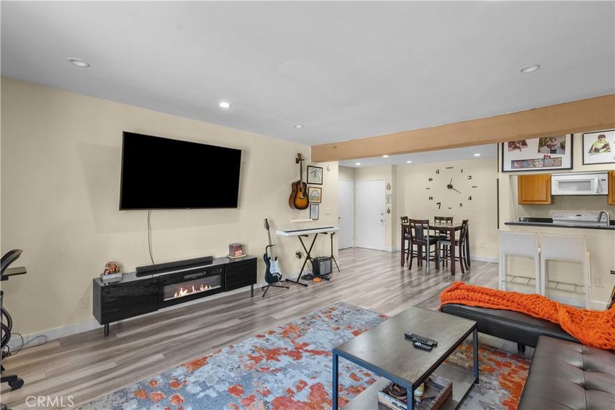 Welcome to Unit #C204 at 5460 White Oak Ave — a beautifully upgraded 2-bedroom, 2-bathroom condo offering 990 square feet of modern living space, complete with a large private balcony. This thoughtfully designed unit features two spacious primary bedrooms located on opposite sides of the living room, each with its own full bathroom, providing comfort and privacy for residents or guests.

The interior has been recently updated with brand-new laminate and vinyl flooring throughout, along with fully remodeled bathrooms showcasing sleek, contemporary finishes. The plumbing has been upgraded for improved efficiency and reliability. Smart home integration allows for convenient remote control of lighting and HVAC systems, enhancing everyday comfort while promoting energy savings.

This well-maintained community offers a wide range of resort-style amenities, including controlled access and security, a swimming pool, spa, sauna, fitness center, tennis courts, a clubhouse, recreation room, billiard and card rooms, a playground, and a sport court. Residents also enjoy access to an outdoor BBQ and cooking area. The HOA dues include hot and cold water, trash, sewer, earthquake insurance, and on-site management. The building is pet-friendly as well.

Located just south of the 101 freeway in the heart of Encino, this condo is within walking distance to Ventura Blvd, offering easy access to shopping, restaurants, and entertainment. Don’t miss this fantastic opportunity to own a move-in-ready, smart-enabled home in one of the most desirable areas of the San Fernando Valley.