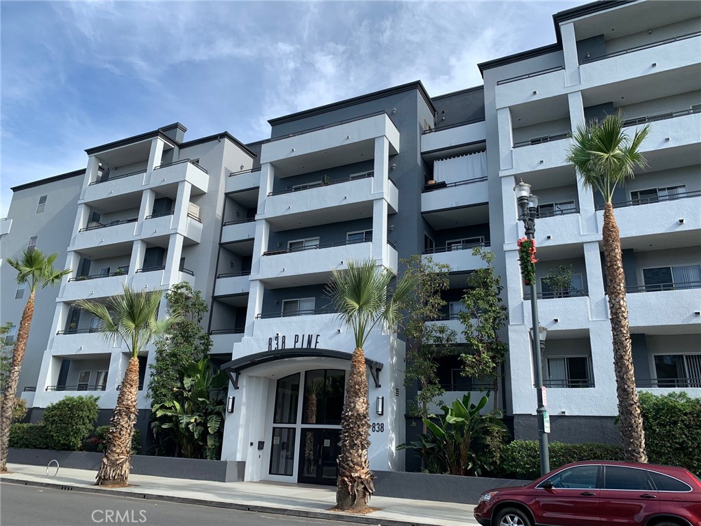 Well-maintained 5th-floor condo with amazing views from the balcony towards the mountains. Walk to restaurants, shopping, and downtown events. Modern kitchen, Refrigerator, electric range, all appliances included. Breakfast bar & separate dining area. Includes inside the Laundry closet with a stacking washer and dryer. Two spacious bedrooms, each with a full bathroom for added privacy. The community features a security entrance, an exercise room, a courtyard for outdoor dining, and two underground parking spaces. Easy access to 710 Fwy, Coastal access, and charming Shoreline Village and the Pike Outlets are just a short drive away.