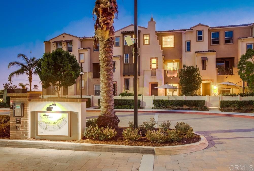 Stunning 3-bed, 3-bath townhome in the gated Pacific Ridge community of Oceanside. Built in 2017, this 1,569 sq. ft. home features an attached 2-car garage(epoxy flooring) and premium upgrades that were professionally designed, including luxury flooring and wallpaper throughout with premium in ceiling speakers and alarm system with CCTV cameras. The gourmet kitchen boasts stainless steel appliances and granite countertops. A tankless water heater with repeater, whole house filtration and water softener system, excellent insulation, and efficient HVAC make this home energy efficient and soundproof along with a solar system that is already paid for and owned. The primary bedroom offers a spacious walk-in closet, and all bedrooms enjoy ample natural light. The low-maintenance yard features drought-tolerant plants on a drip system, wood like tile, and built in BBQ/outdoor kitchen perfect for entertaining. Pacific Ridge offers resort-style amenities, including a pool, hot tub, parks, BBQ areas, and seasonal community events. The community is family- and dog-friendly with on-site security and gated access. Conveniently located 0.9 miles from a shopping center with dining and services, 7.7 miles from Oceanside Pier, and within proximity to schools (Ivey Ranch, MLK, and El Camino High).