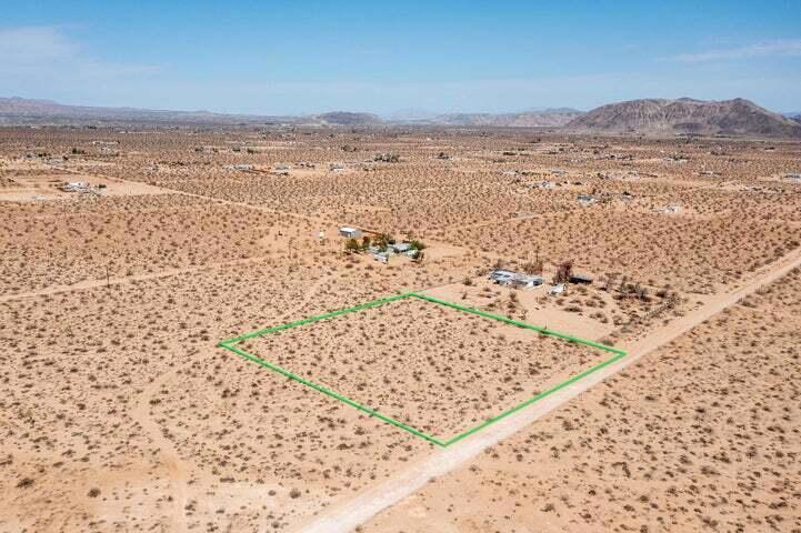 2.27 acres with privacy, views and water is in the street! Power is next door or go full solar. Zoned residential. Road access. Starry nights. Horse property. Ideal for a designer compound. The southeastern area of Landers is known to have some of the highest priced homes in Landers due to its proximity to Joshua Tree. Vistas of Mt Nebo, Reche Mtn, Goat Mtn, Copper Mtn and the vast Bullion Mtns that often glow red in the last light of the day. Less than 1 mile to over 600 acres of BLM wilderness for hiking, dog walking and horseback riding. Only 25 minutes to the Joshua Tree National Monument where about 3 million tourists visit annually. Hot vacation area. 70 minutes to Big Bear. 57 minutes to Palm Springs. 2 hours and 20 minutes to Los Angeles. Great location for your dream home. Buyers must contact the county with all questions on building and usage. Buyers must contact the appropriate utilities companies with all questions on utilities. APN: 0630152100000. Address is not an assigned address and is for marketing purposes only. GPS: 34.257597, -116.351680