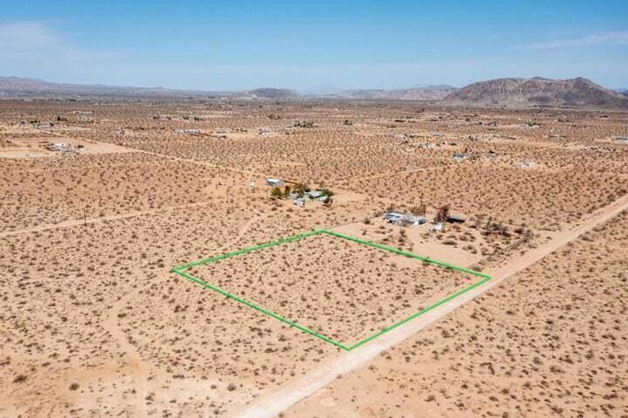 2.27 acres with privacy, views and water is in the street! Power is next door or go full solar. Zoned residential. Road access. Starry nights. Horse property. Ideal for a designer compound. The southeastern area of Landers is known to have some of the highest priced homes in Landers due to its proximity to Joshua Tree. Vistas of Mt Nebo, Reche Mtn, Goat Mtn, Copper Mtn and the vast Bullion Mtns that often glow red in the last light of the day. Less than 1 mile to over 600 acres of BLM wilderness for hiking, dog walking and horseback riding. Only 25 minutes to the Joshua Tree National Monument where  about 3 million tourists visit annually. Hot vacation area. 70 minutes to Big Bear. 57 minutes to Palm Springs. 2 hours and 20 minutes to Los Angeles. Great location for your dream home. Buyers must contact the county with all questions on building and usage. Buyers must contact the appropriate utilities companies with all questions on utilities. APN: 0630152100000. Address is not an assigned address and is for marketing purposes only. GPS: 34.257597, -116.351680