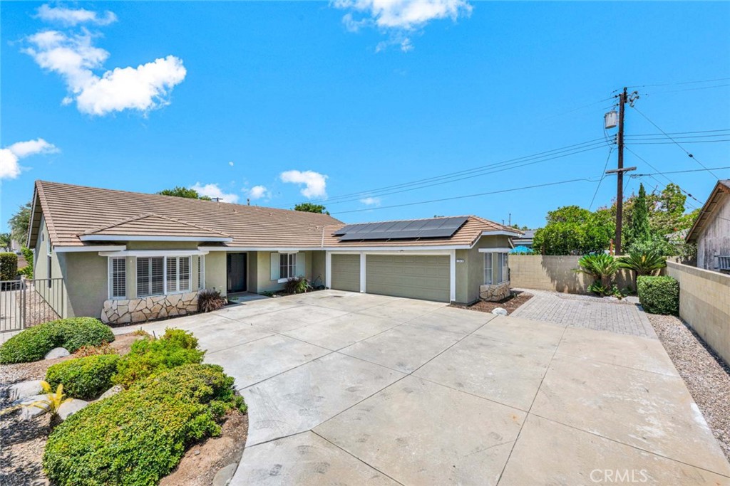 PRICED BELOW MARKET FOR A QUICK SALE! Beautifully upgraded 2478 sq. ft. single story gem showcasing 4 bedrooms, 2.5 bathrooms, in the City of Orange, Orange Park Acres area with an expansive 12,750 sq. ft. lot. A private lush backyard with mature landscaping, fruit trees, a large storage shed, stepping stones and block wall fencing. A long private driveway for RV parking and exterior paver hardscaping. Stone accents and shutters in the front of the house, a classic tile roof with paid solar panels! Elegant double-door entry into a bright open-concept layout living room with vaulted ceilings, views of the front yard and new wide-plank vinyl wood flooring throughout, an area for the dining room table for entertaining your guests, new farmhouse style wooden light fixtures and plantation shudders. The guest bathroom has a new vanity, new faucet, new mirror and new light fixtures. Hallway linen storage area with granite countertop. A spacious family room with a newly upgraded gas fireplace with tile surround, built-in bookshelves, and a cozy office nook complete with cabinets, shelving, and new recessed lighting. A single French door in the kitchen area leads to the enclosed patio with screened lattice and two sky lights for natural lighting. Great area for get togethers. The upgraded kitchen is a chef’s dream, showcasing new granite countertops, custom Herringbone backsplash, new stainless steel appliances, new built-in oven and microwave, and 5 burner stove top, a dual stainless-steel sink with new faucet, and ample cabinet storage—including pull-out spice racks and glass-front cabinets. The master suite has views of the lovely backyard, high ceilings, a new fan and double door entry. A remodeled master bathroom features new porcelain tiled shower and soaking tub, dual vanities with new faucets, and updated lighting fixtures. The large walk-in closet features built-in shelving and mirrored beveled closet doors. The secondary bedrooms are generously sized with high ceilings, an upgraded Jack and Jill bathroom with new granite countertop, new backsplash, new faucets, new light fixtures and new hardware. Additional highlights include newer interior doors and hardware, new ceiling fans, new light fixtures, freshly painted interior, inside laundry room with sink and cabinets, attached 3-car garage, 2-ton A/C and tankless water heater. Minutes from the 55, 91, 241 and 57 freeways. Close to schools, parks, restaurants and shopping! No HOA and no Mello Roos.