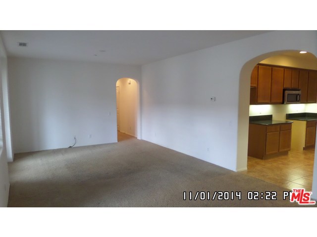 Gorgeous Spanish Walk 2 BR 2 BA condo with lots of upgrades. Kitchen has lots of counter space with granite slab counters, under cabinet lighting, and 16 ceramic floor tiles. Inviting Open and bright floor plan. Formal dining room off kitchen with lots of cabinets. Living room is generous in size and has French doors with phantom screens leading to a large patio balcony for entertaining. Also on the balcony is a large storage closet. Master BR has mirrored closet doors as does the 2nd BR. Second bathroom completely tiled from floor to ceiling, oversized bath tub, Moen fixtures and custom shower door. Laundry area in unit. Attached 2 car garage with extra storage and epoxy flooring. Complex includes 3 pools, one is an Olympic size pool, spa, fitness center, and club house. This unit is located a few steps from the pool which is very convenient and close to the UC campus. Must see to appreciate!