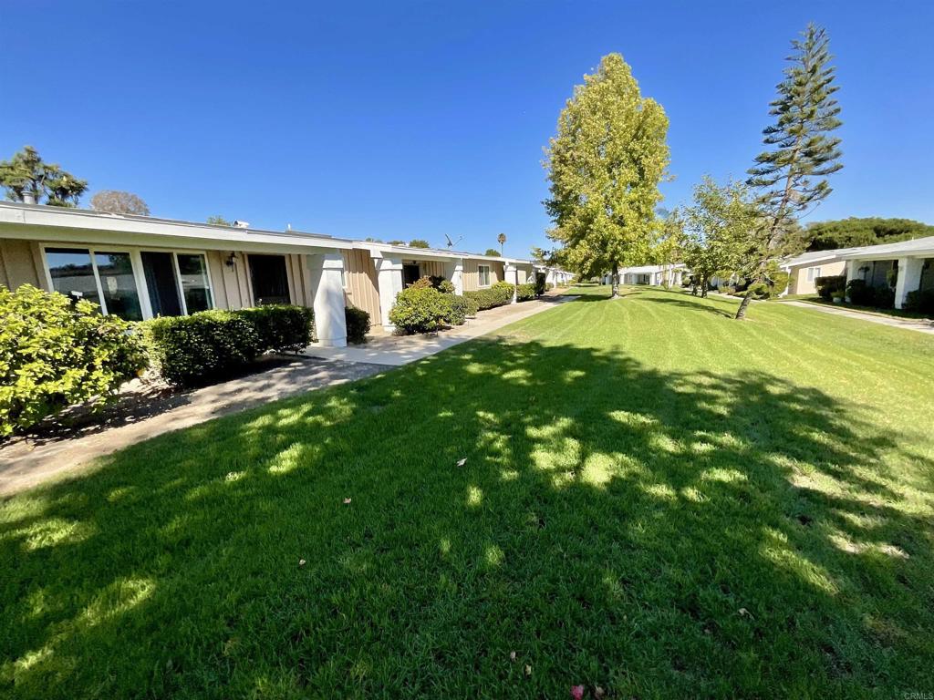 Beautifully updated Oceana 3 home shows light and bright. All newly painted exterior and situated on quiet parklike grounds. Light vinyl plank wood flooring, new dual pane windows throughout, mirrored wardrobes, all new primary bath and all new hall half bath powder room. Large living room overlooks large dining room with lighted ceiling fan. Kitchen with updated cabinets and butcher block look countertops. Stainless steel refrigerator included. Attached one car garage with a new garage door and attached large covered patio with a skylight and wrought iron secure fencing that doubles as a carport. Security screen doors at both the front and rear of the home. All paid for by the HOA water, trash, sewer, Cox cable, landscaping and exterior painting maintenance. Oceana has a clubhouse, pools, tennis and all of these activities and amenities in this wonderful 55+ complex near all shopping, restaurants and beaches. https://www.ocaoceanside.com/oceana-activities.html Link to HOA website- https://www.ocaoceanside.com Art Activities - Art Studio, Ceramics, Lapidary, Woodshop. Clubs - Book Club, French Club, Garden Club. Exercise - Band Exercises, Chair Volleyball, Chair Yoga, Golf, Keep Fit Exercise Class, Line Dancing, Pickleball, Tai Chi, Water Aerobics. Games - Billiards, Cribbage, Dominos, Hand & Foot, Mai Jong, Pinochle, Poker, Trivia. Misc - Coffee Hour, Discussion Group, Friends of Bill W, Sing-Along. There is a daily calendar with activities and events from morning until night everyday!