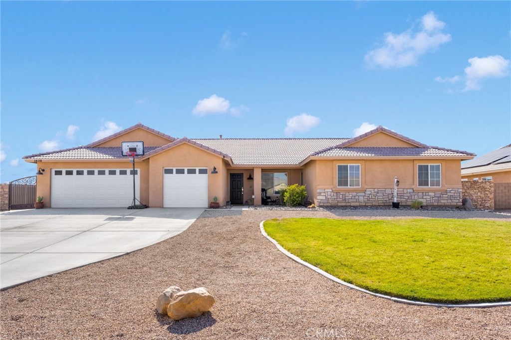 This spacious 4 bedroom, 2 bathroom home sits on a generous lot offering RV parking and ample outdoor space and privacy. The split floor plan provides a comfortable layout, with a large master suite featuring doors that lead directly to a private backyard- perfect for relaxing or entertaining.
The master bathroom includes a luxurious atmosphere, while the guest bathroom boasts dual sinks for added convenience.
The modern kitchen showcases a sizeable island sleek cabinets seamlessly flowing into the expansive living room with beautiful stonework ideal for family gatherings and entertaining guests.
This home combines comfort, style, and functionality in a wonderful setting.