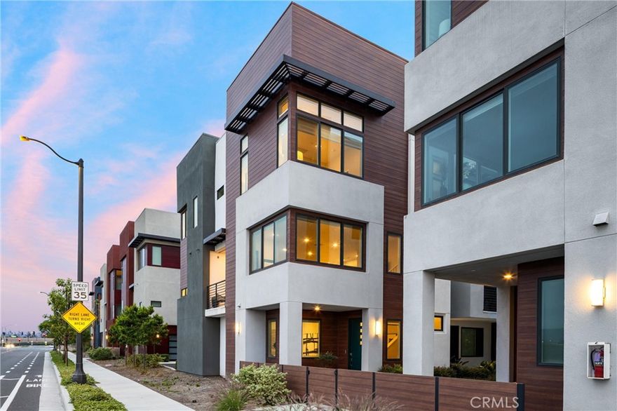 Experience elevated living in this stylish and sun-soaked 4-bedroom, 3.5-bathroom home located in the sought-after Levity community at Tustin Legacy. Spanning 2,202 square feet, this premium corner unit enjoys incredible natural light in every room, enhanced by its open-facing orientation—a rare find that makes the entire home feel bright, open, and inviting. Step inside to discover modern finishes and thoughtful upgrades throughout, giving the home the polished feel of a model home. You’ll find newer luxury vinyl plank flooring and interior paint (2023), sheer and blackout roller blinds, a tankless water heater, and a dedicated laundry room for added convenience.The main level features a private bedroom and full bathroom, ideal for guests, in-laws, or a home office. On the second level, the heart of the home unfolds in the spacious great room, where the living area, dining space, and chef’s kitchen flow effortlessly together. The kitchen is an entertainer’s dream—complete with a large center island, quartz countertops, stainless steel appliances, ample cabinetry, and a separate walk-in pantry. Upstairs, the primary suite offers a true retreat—boasting large windows that frame beautiful natural light, a generous walk-in closet, and a dual-sink vanity. Down the hall are two additional well-sized bedrooms, each filled with light and charm, along with a large shared bathroom featuring dual sinks, perfect for family or guests. Residents of Levity enjoy resort-style amenities including a pool, spa, and BBQ areas—ideal for both weekend relaxation and entertaining. All of this is perfectly located near top-rated Legacy Magnet Academy, The District and Village at Tustin Legacy shopping centers, lush local parks, and Bark Barracks dog park. With Newport Beach and John Wayne Airport just minutes away, this home offers the ultimate blend of style, comfort, and convenience. Bright, beautifully upgraded, and move-in ready—this is the one you’ve been waiting for. Come take a tour today!