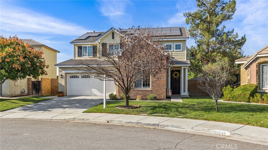 Welcome to your next chapter in this stunning 4-bedroom 3-bathroom family home that perfectly balances comfort and style. This beautifully designed 2,309 square foot residence showcases upgrades that are aesthetically pleasing and functional throughout. From the moment you step inside, abundant natural light floods the open floor plan, highlighting the gorgeous, custom accent wall, upgraded light fixtures, and elegant laminate floors. This home offers a thoughtfully designed living room and dining room that are perfect for entertaining family and friends, complete with custom built-in cabinetry and dual wine refrigerators. The GOURMET KITCHEN which opens to the community room features GRANITE COUNTERTOPS, newer STAINLESS-STEEL APPLIANCES, a center island with an eat-up bar, deep sink, and plenty of cabinet space. With a cozy and stylish fireplace, the community room is warm and inviting. There is also a convenient DOWNSTAIRS BEDROOM AND FULL BATHROOM perfect for guests or multi-generational living. Heading upstairs you will find NEWER PLUSH CARPET, a versatile LOFT area that may be transformed into a home office, gym, media room, or playroom. Retreat to your luxurious primary suite, complete with a WALK-IN CLOSET and a SPA-LIKE ENSUITE BATH with dual sinks and an oversized soaking tub. Two additional bedrooms upstairs and another full bath with dual sinks. The backyard is nicely landscaped with a covered patio and even a grass area for your pets. Ceiling fans throughout and also equipped with 32 solar panels, the current owners enjoy the freedom of having NO EDISON BILL. Located on a quiet street within a vibrant community, this home is just moments away from nearby schools, shopping centers, parks, recreational facilities, and a lake, making it an ideal environment for families. Don't miss this rare opportunity to embrace a lifestyle of comfort and community. Schedule your private tour today and experience firsthand what makes this home so special!