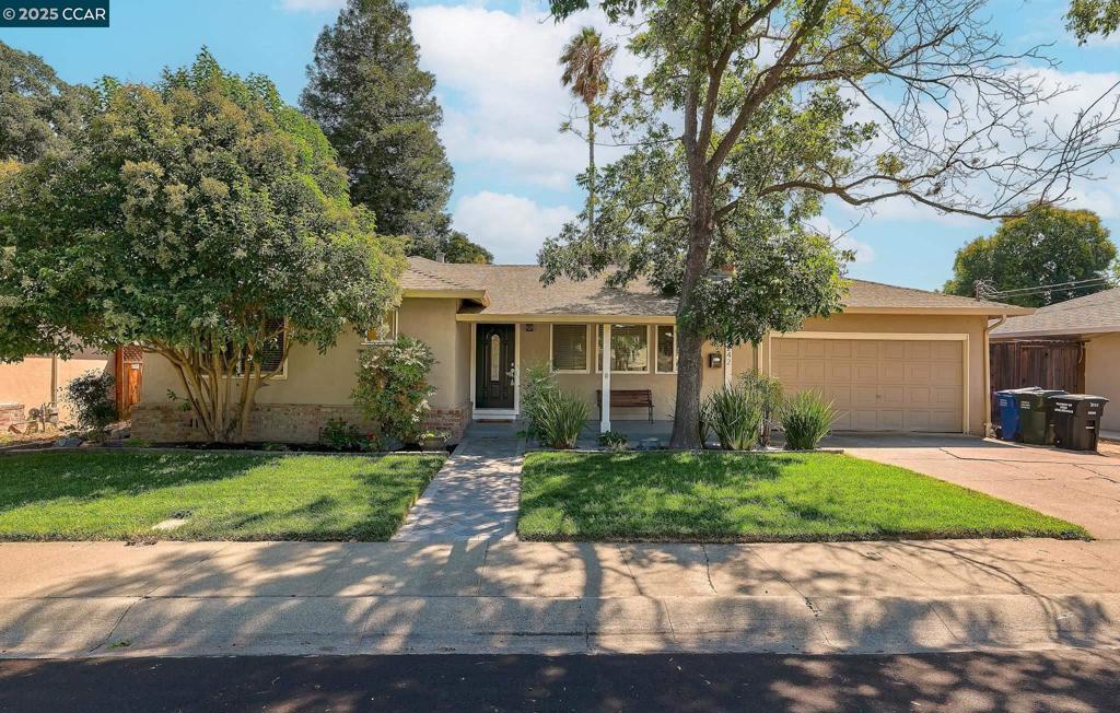 Adorable Holbrook Heights charmer! This darling 3 bedroom 2 bath rancher is one of the cutest on the block. Features include updated kitchen and bathroom, fresh interior paint, cozy fireplace with mantle, ceiling fans and much more! New landscaping is stunning, including new pavers, lawn and irrigation. Perfect for entertaining, gardening and relaxation! Location is incredible!!! Walk to the community pool, park, school and North Concord Bart. Minutes to quaint Todos Santos Plaza and the famous Tuesday Farmers Market, restaurants and shopping. Don't miss this one!