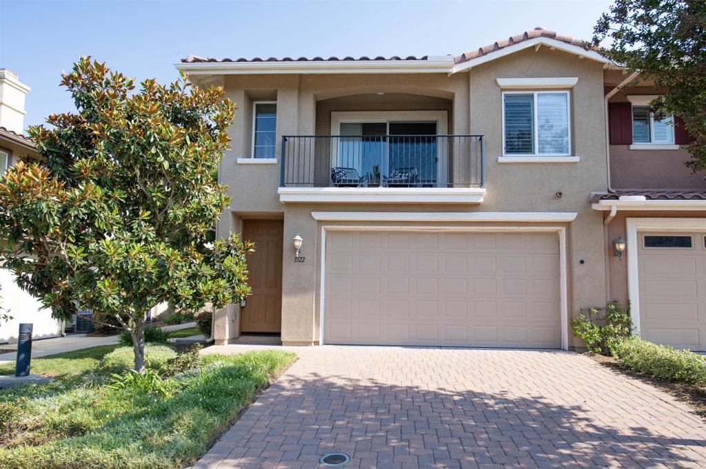 Welcome to 1322 Isabella Way, a beautifully maintained 2-bedroom, 2-bath townhome offering almost 1,300 sq ft of light-filled living space in the heart of Vista. Built in 2010, this end-unit home sits in a newer community and features a bright floor plan, granite countertops, stainless steel appliances, and a cozy fireplace. Enjoy the convenience of an attached 2-car garage, in-unit laundry, central A/C, and a private balcony with peaceful park views. Centrally located near shopping, dining, top-rated schools, and just minutes to Hwy 78 — this is a fantastic opportunity for first-time buyers, investors, or anyone seeking turnkey, low-maintenance living in North County San Diego.
