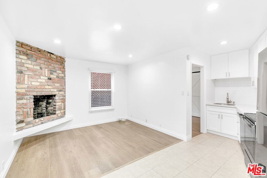$2,495/mo on an 18-Month Lease! 12-Month Lease availble for $2,595/mo. This is a unique one! Vintage New York cosmo feel but still has that Santa Monica beach breezy vibe. Perfect for the edgy, no-nonsense, sun-kissed, easy-goer.Lounge around in the recently renovated, open-concept living room and kitchen with beautiful decorative fireplace. Linger long in bed in the bright and billowy bedroom. Get to work in the too cool bonus room you could turn into an office, studio, dining room, whatever - you're fab, we know you have something amazing in mind for all those living areas! Smack dab in the heart of Santa Monica, minutes to the beach - so close to the 10 and Expo Metro Line - dash around town in a flash. Walking distance: Enjoy the Saturday Farmer's Market, or Whole Food. Lo/Cal Coffee is right there too - a neighborhood fave! The unit comes with dedicated and gated parking with space for two cars in tandem, and there is an on-site laundry room.