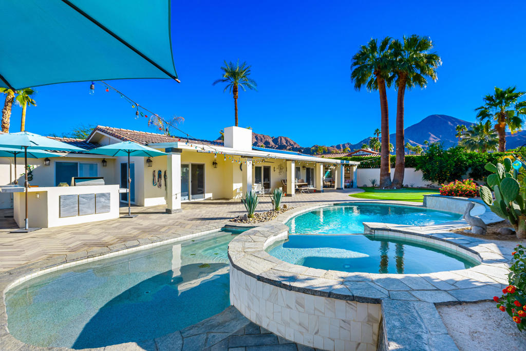 Welcome to this beautifully updated 4 bed, 4 bath home in the highly sought-after community of Indian Wells. This property is a rare find, as it's not part of an HOA. As you approach the home, you're greeted by a stunning front yard with lush landscaping that sets the tone for the rest of the property. The backyard is a true oasis, featuring a pool and spa which was recently drained and blasted clean, a putting green, and plenty of space for outdoor entertaining and relaxation. Inside, you'll find an updated home with modern amenities designed for comfort and convenience. The home is equipped with owned solar panels, Tesla backup battery and a Tesla charger is also available for your electric vehicle. For ultimate comfort, the home boasts a new high-efficiency air conditioner and furnace, keeping you cool during the hot desert summers and cozy in the winter months. Additionally, a new 50-gallon recirculating water heater provides instant hot water throughout the home. kitchen appliances have been upgraded, including a new refrigerator, new dishwasher, and new microwave. A whole-house Culligan water filtration system with a reverse osmosis tap and a refrigerator water line ensures clean, purified water for you and your family. A highlight of the property is the new raised bed irrigated garden, perfect for growing your own fruits and vegetables. This home blends luxury, sustainability, and functionality, offering the ideal setting for modern desert living. Don't miss the chance to make this remarkable property your own! *DO NOT DISTURB OCCUPANTS*