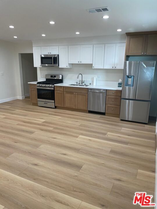 Beautifully Upgraded 2-Bedroom, 2-Bathroom ADU for Rent in North Hollywood. Newly built and move-in ready ADU offering approximately 900 sq. ft. of modern living space. This home features a bright open-concept layout with a spacious living area and a fully upgraded kitchen equipped with stainless steel appliances, quartz countertops, and ample cabinetry. Enjoy two well-sized bedrooms and two full bathrooms designed with comfort and functionality in mind. The property also includes parking on the driveway and a private gated entrance. All utilities are included in the rent.