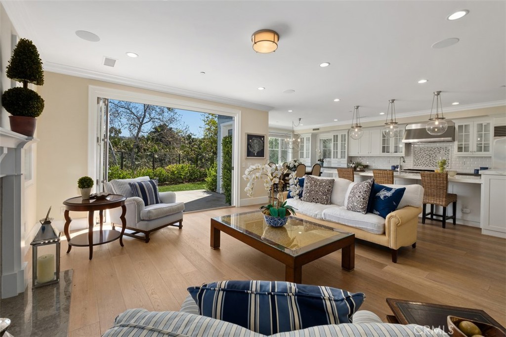 Welcome to your own private oasis - FULLY FURNISHED stunning 2012 custom-built home tucked away in a peaceful cul-de-sac adjacent to the serene Harbor View Nature Park. As you enter through the dramatic entry, the Coastal Craftsman architecture will captivate you, inviting you to bask in the home's beauty and serenity. Boasting a bright and spacious open floor plan that offers stunning view of the park, this upgraded home features Provenza Old World Collection hardwood floors, 4 spacious bedrooms, and 3 full bathrooms, including a main floor bedroom and bathroom for added convenience. The gourmet kitchen is a chef's dream, equipped with state-of-the-art Miele, SubZero and Wolf appliances, luxurious marble and granite countertops. Located in an excellent school district that includes Corona Del Mar High School and Lincoln Elementary School, this home is in close proximity to world-class golf clubs, restaurants, a movie theater, Fashion Island shopping plaza, and some of the most beautiful beaches in the world. Don't miss this opportunity to live in this luxurious home and experience the ultimate California lifestyle! Lease term negotiable.