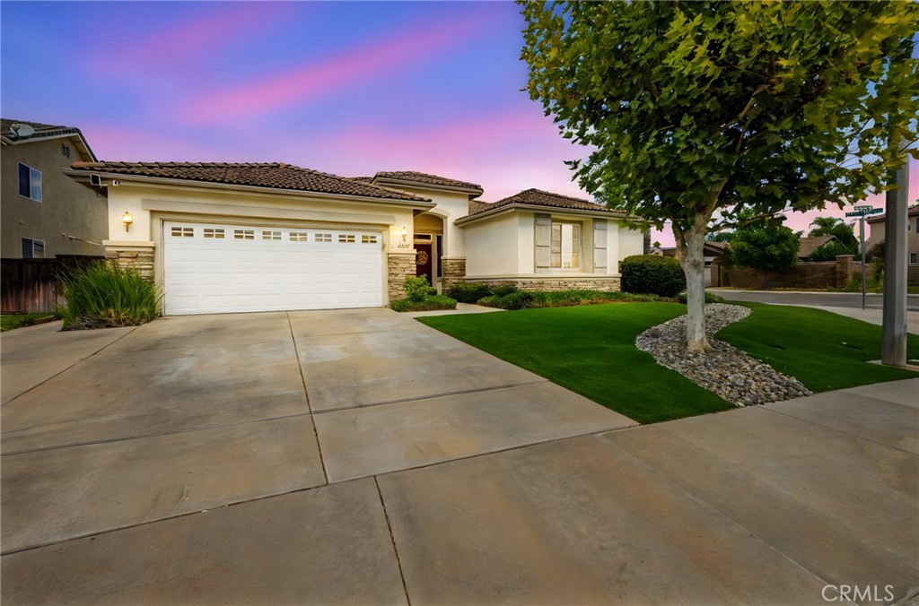 Welcome to 28602 Windridge Drive – a stunning single-story home designed for entertaining and everyday comfort!
Offering 2,773 square feet of beautifully designed living space, this 4-bedroom, 3-bathroom residence sits on a desirable corner lot and showcases impressive curb appeal with its lush artificial turf front yard for a clean, low-maintenance look year-round.
Inside, you’ll find an open and inviting floorplan that seamlessly connects each living space. The formal living room has been transformed into a stylish bar, creating the perfect centerpiece for gatherings with direct access to the formal dining room, family room, kitchen, primary suite, and backyard. A stone fireplace adds warmth and charm to the main living area, creating an ideal space to relax or entertain.
The chef’s kitchen is open to the family room and features a large central island, white cabinetry, custom countertops, a subway tile backsplash, and stainless-steel appliances. With multiple access points to the backyard and formal dining area, this layout makes hosting family and friends effortless.
The primary suite offers a peaceful retreat with LVP flooring, backyard access, a sliding barn door to the ensuite bath, and a mini-split HVAC system for personalized comfort. Three additional bedrooms complete the home—two connected by a Jack & Jill bath and a third currently set up as an office with a built-in desk, adjacent to the guest bathroom.
Step outside to enjoy the private backyard featuring a covered patio, artificial turf, large concrete entertaining area, above-ground spa, garden, BBQ space, and storage shed.
Located in a highly convenient area near the 215 freeway, Mt. San Jacinto College, shopping, and dining, this home perfectly blends style, functionality, and location.