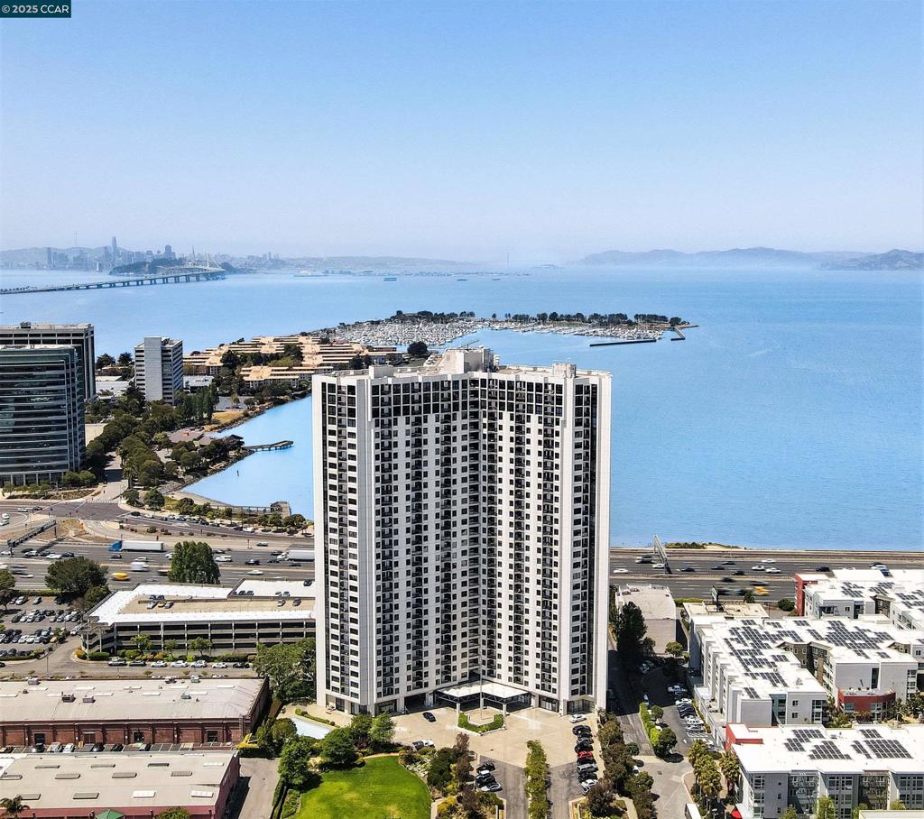 Fantastic opportunity to own a piece of Emeryville's Premier Luxury High-Rise condominium at an amazing price! Seller is Open to Seller Financing. Residents here at Pacific Park Plaza enjoy resort-like amenities, including a heated swimming pool, hot tub, sauna, tennis courts, fitness center, a large bay view lounge, 24/7 front deck concierge and security and garage parking! A perfect starter home for First-Time buyers or investors, this slight cosmetic fixer also has newer stainless steel appliances and a modern toilet. Perfectly located in the center of the Bay Area just minutes from San Francisco, Emeryville is home to some of East Bay's finest shopping, dining and entertainment, including Bay Street shopping center, an easy walk away. Emeryville Marina and the Bay Trail walking & biking path are at your doorstep. There's a beautiful park and food court just across the street. Plus many public transportation options, including Amtrak, Casual Carpool, Express Buses, and a free shuttle that takes you all over town and to BART!
