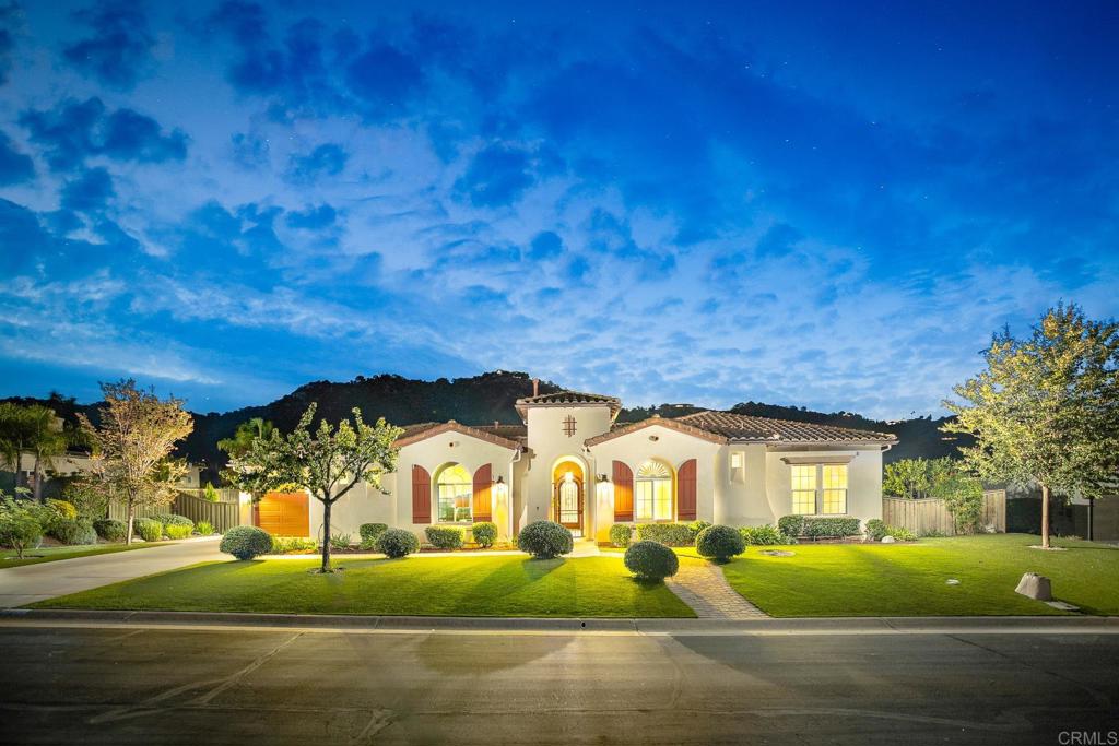 Valley Centers Gated Gem. The Community of Woods Valley is surrounded by the Native Oaks Golf Course and mountain views. This updated single story ranch style home features 3,546 SF of Open Concept living with 4 large bedrooms, 3 full baths, 1/2 bath, dedicated office, flex room, 4 car attached garages on .42 Acres on an elevated cul-de-sac. Welcome guests through the custom wrought iron gate into your openair courtyard with stone finishes. Inside formal living room and dining room are open and bright with wall to wall french doors. The combined family room, kitchen and breakfast nook with island seating has plenty of space for large gatherings. Primary suite has private bath, dual sinks, vanity, walk in closet and bay window, plenty of space to create a workout area or build a second walk in closet. On the other side of the home you will find Bedrooms 2 and 3 that share a jack and jill bath and bedroom 4 with private bath in addition there is a flex room in the middle that looks over the courtyard. Additional improvements: 72" LVP Flooring has been installed throughout the home along with 5" baseboards, interior doors are newly painted, new interior hardware, new shut off valves in baths, crown molding (extensive upgrades list available). The front landscape has lush turf and a very clean curb appeal. The Back yard is spectacular from extended covered patio, to the rose gardens to the mature fruit trees, turf, fire pit, free standing gazebo, extensive paver paths and a soaring 3 tier fountain. And to top it all off FULLY PAID SOLAR SYSTEM.