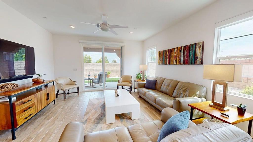 This almost 3 year old home, with 'Owned Solar', is ready for its next owner. In Dolce, a community featuring both two-story and one-story homes, includes this great 3 Bedroom 2 Bath single level home. Beautiful features including a Gourmet Kitchen for any 'chef' enthusiast. It's an open concept area with a large island - quartz, of course, but the way it is laid out, it's open to the Great Room and Dining Area - but it is to the side upon entering the home via the spacious foyer. Upon entering the foyer, there is a hall to the right which allows access to the 2nd and 3rd bedrooms and the hall bath with a tub/shower combination. Further ahead along the foyer, the Kitchen is to the left and then a little further to the right are the Dining Area and the Great Room. The Great Room has a slider to the Lanai-like covered patio with custom artificial green space and an ample side yard for a future private spa, spool and/or swimming pool. Once past the kitchen and across from the Great Room is access to the Primary Bedroom Suite featuring the ensuite bath with dual vanities, a large shower and WC and a large closet - this suite features stunning views of the rear yard as well. Beyond the Kitchen is a pantry closet, the Laundry Room and 2 Car Garage.